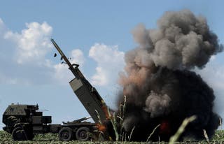 Ukrainian servicemen fire a High Mobility Artillery Rocket System (HIMARS) towards Russian troops, amid Russia's attack on Ukraine, near the frontline in Donetsk region, Ukraine