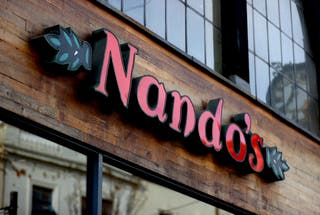 Nando’s is among food outlets passing on the tax saving on children’s meals (Tim Goode/PA)