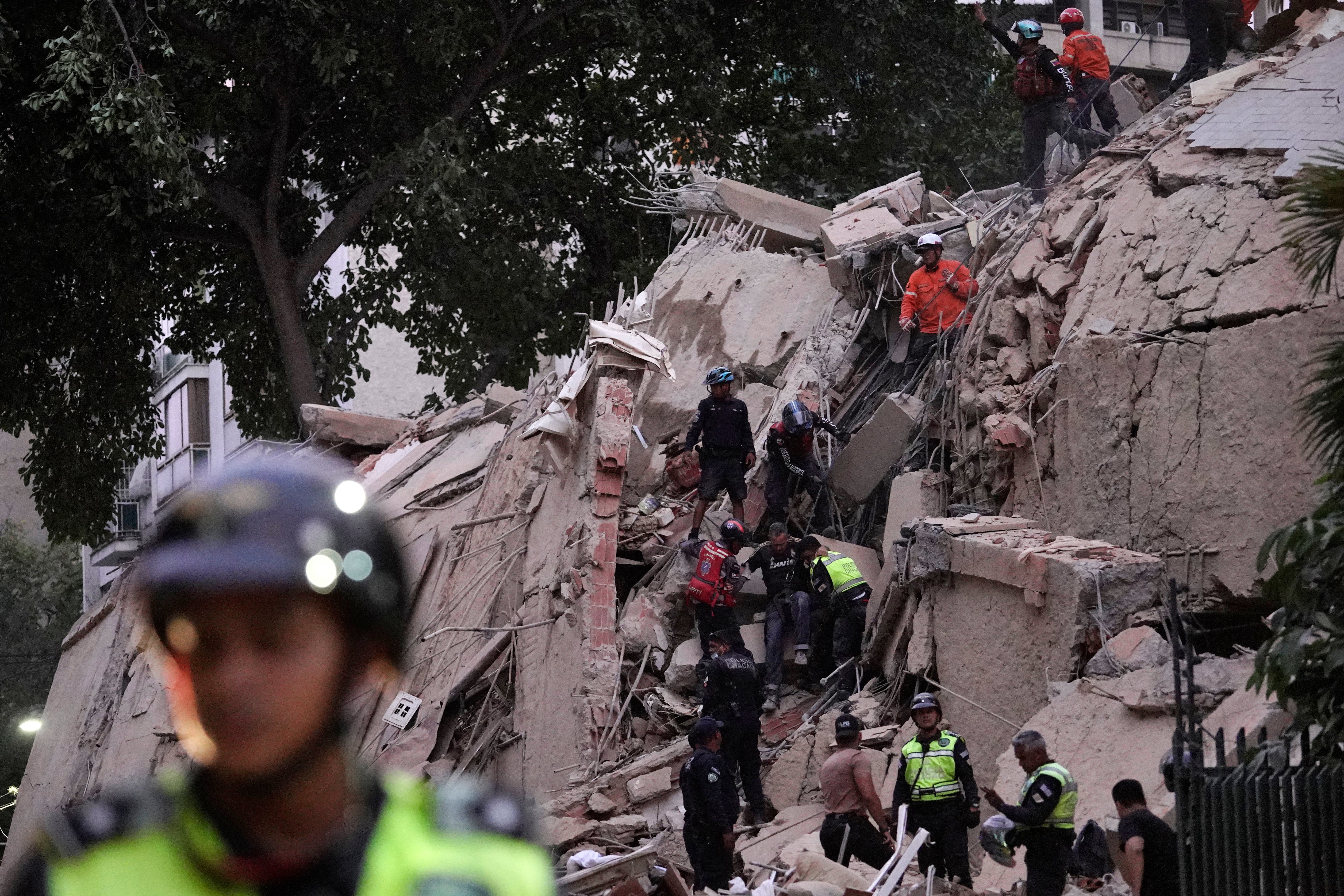 People evacuated swaying buildings in Caracas and remained outside