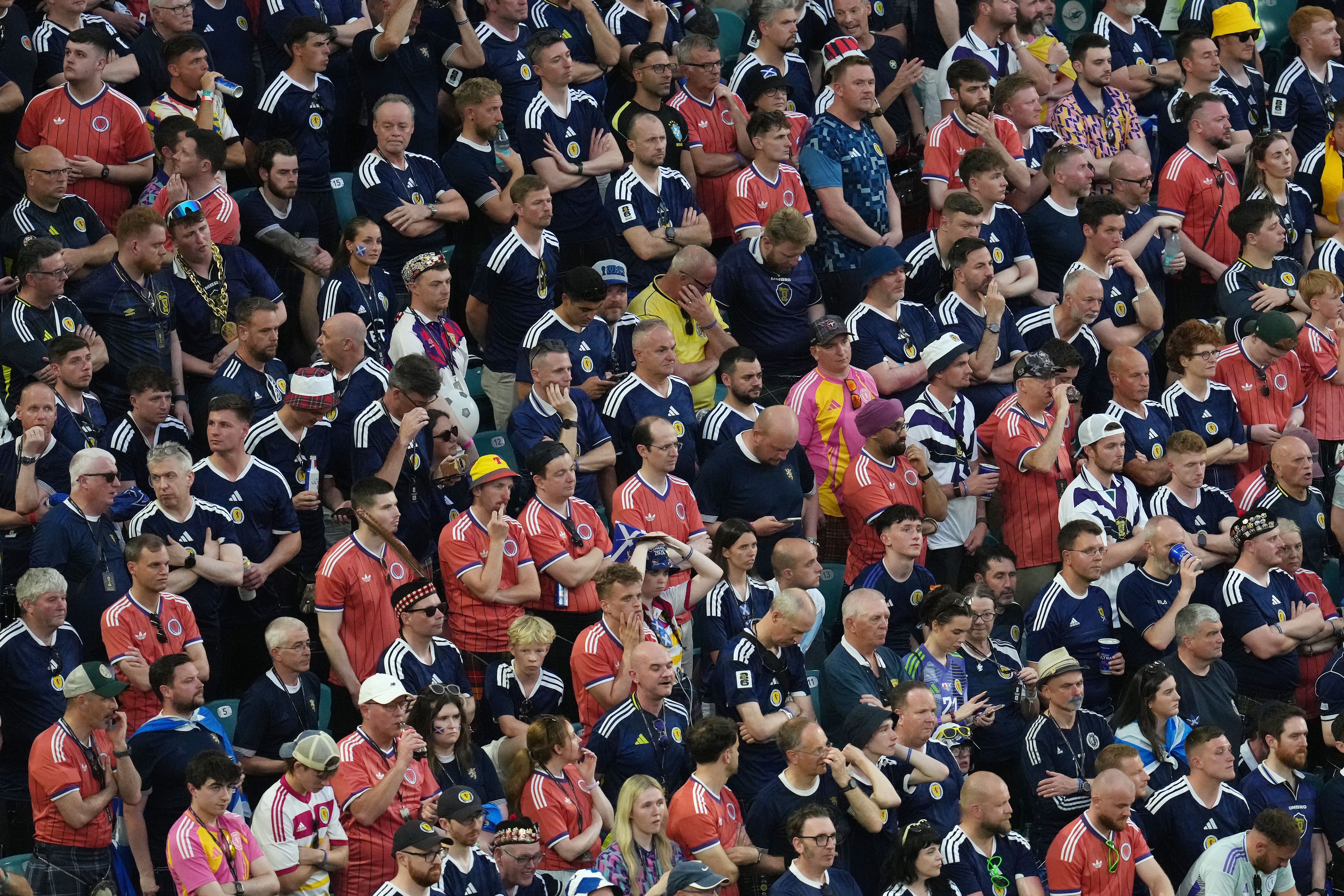 Scotland fans react after Brazil’s Matheus Cunha scores their side’s third goal of the game (PA Wire)