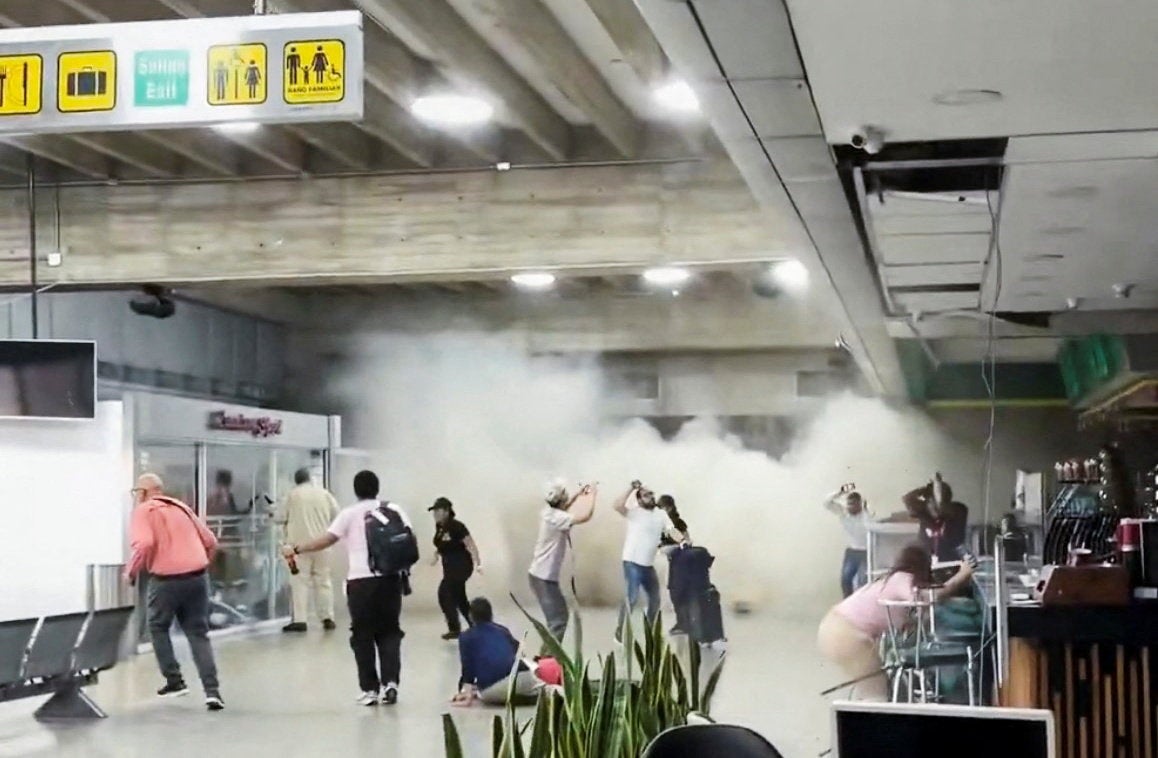 People react during an earthquake at Simon Bolivar International Airport in Maiquetia, Venezuela, 24 June 2026, in this still image obtained from a social media video