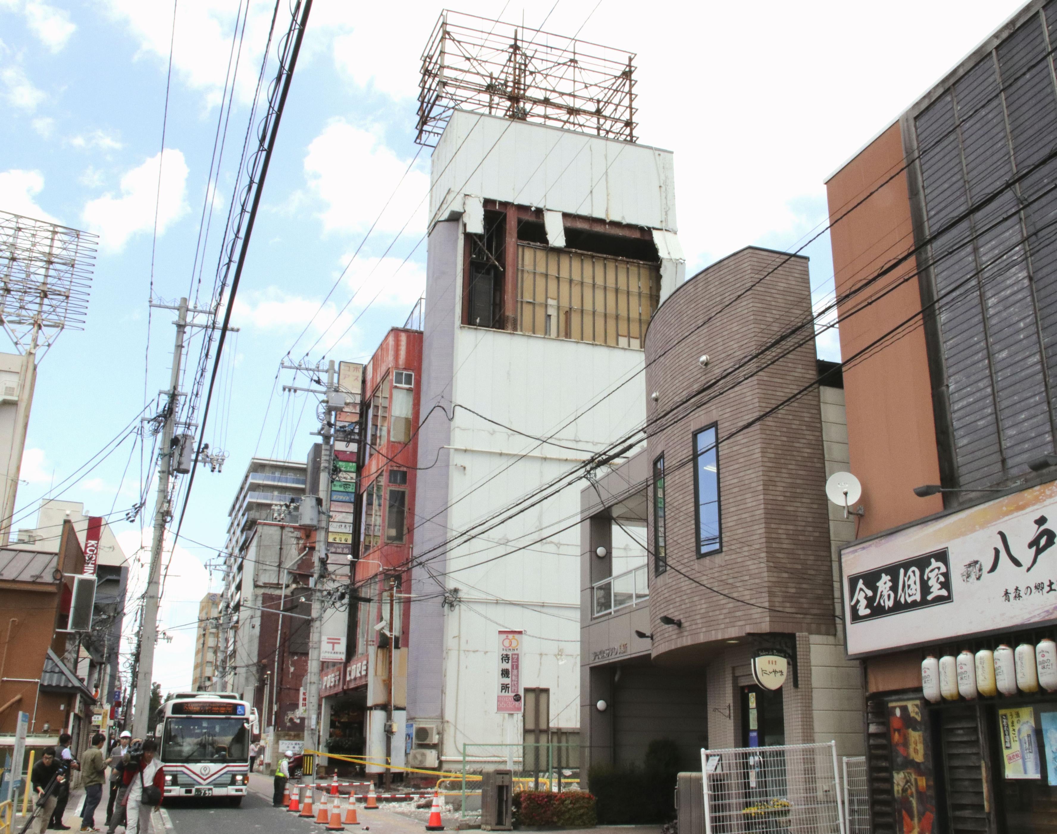 The wall of a building is partly damaged following an earthquake in Hachinohe, Aomori prefecture, Japan, on 25 June 2026