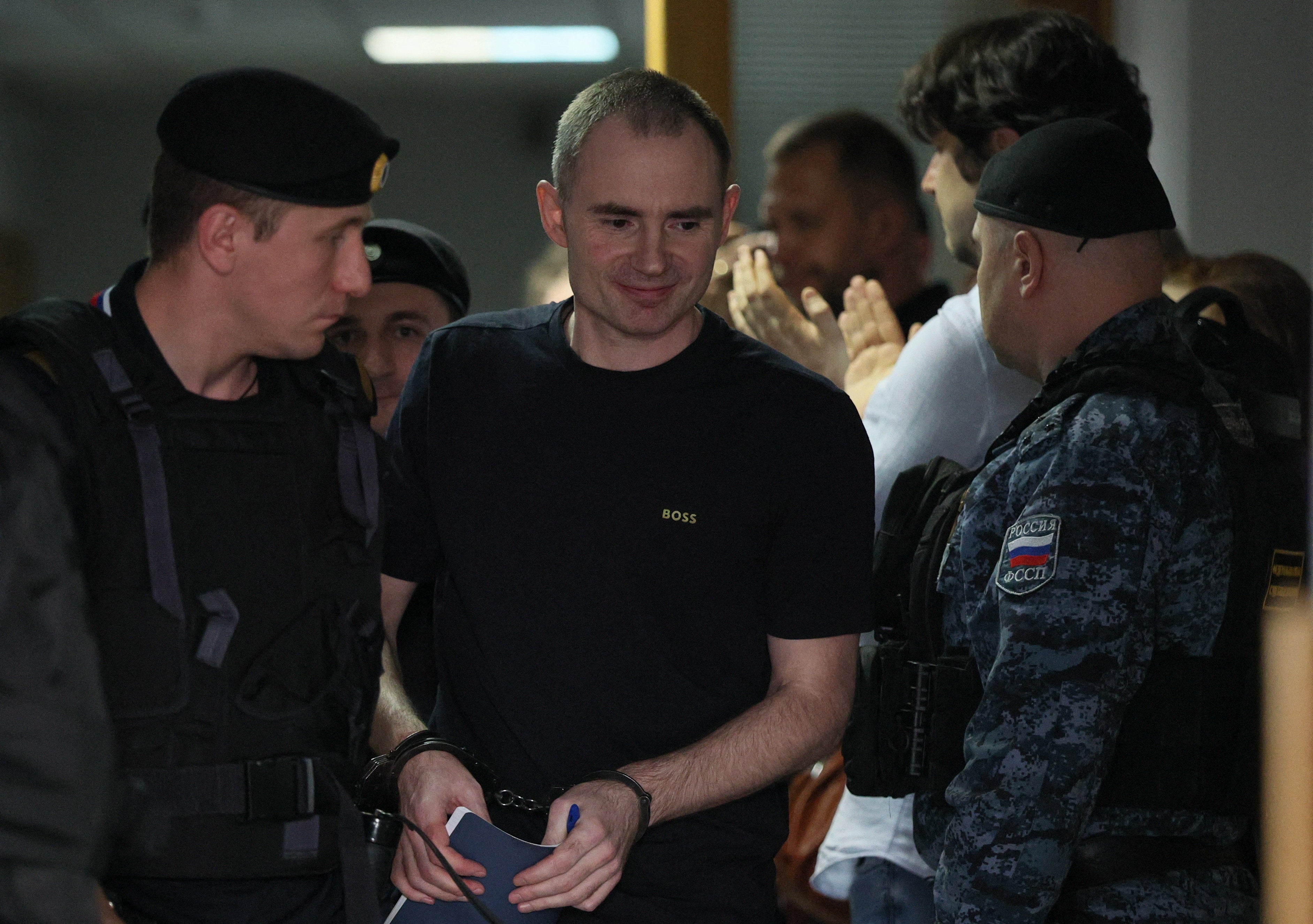 Russian opposition politician and deputy leader of the liberal Yabloko party, Maxim Kruglov, who was convicted of deliberately spreading false information about the Russian army during the conflict against Ukraine and jailed for seven years, leaves a courtroom after a hearing in Moscow