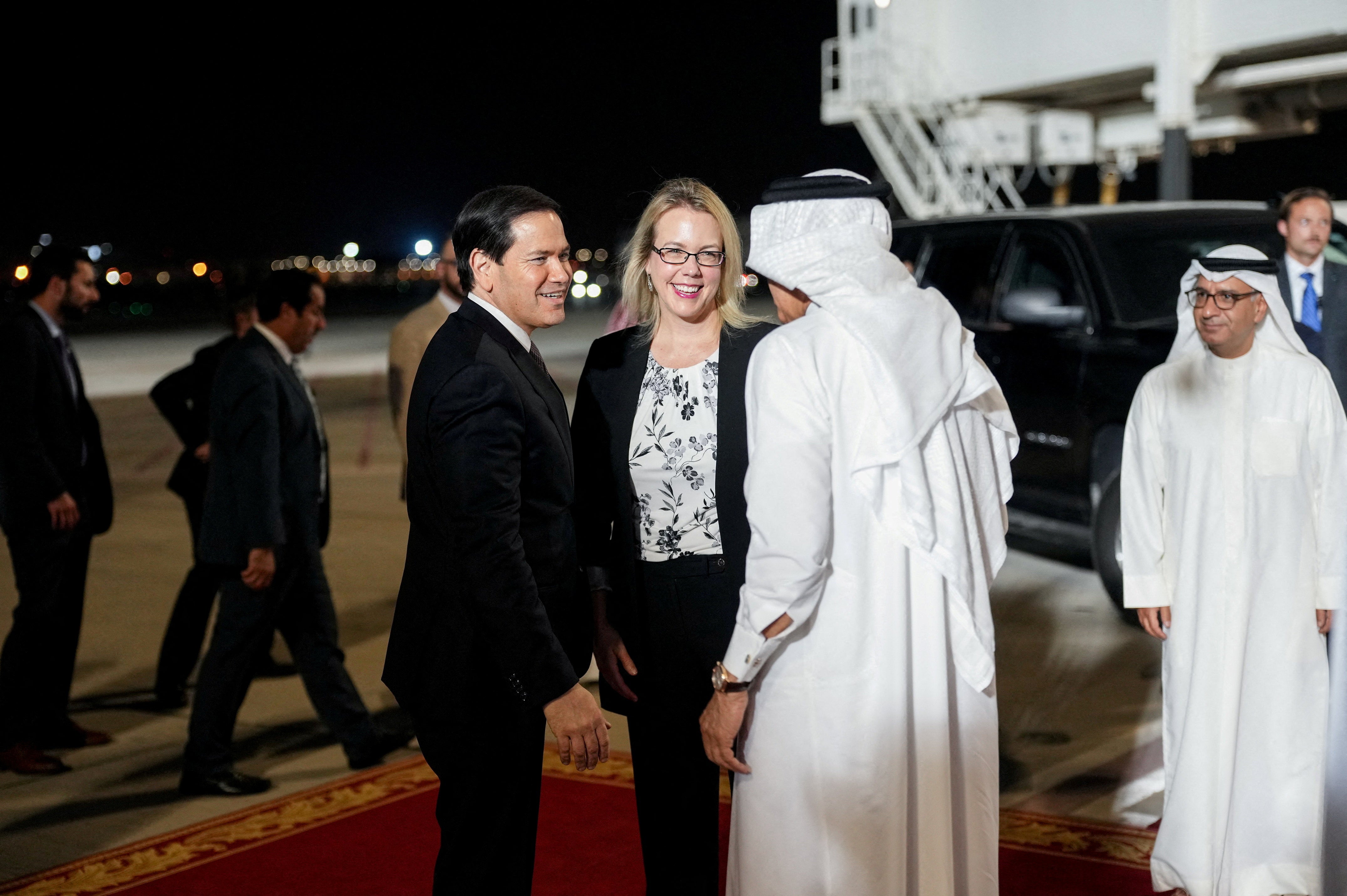 Bahrain's Foreign Minister Abdullatif bin Rashid Al Zayani and U.S. Ambassador to Bahrain Stephanie Hallett greeted the US secretary of state at Bahrain International Airport