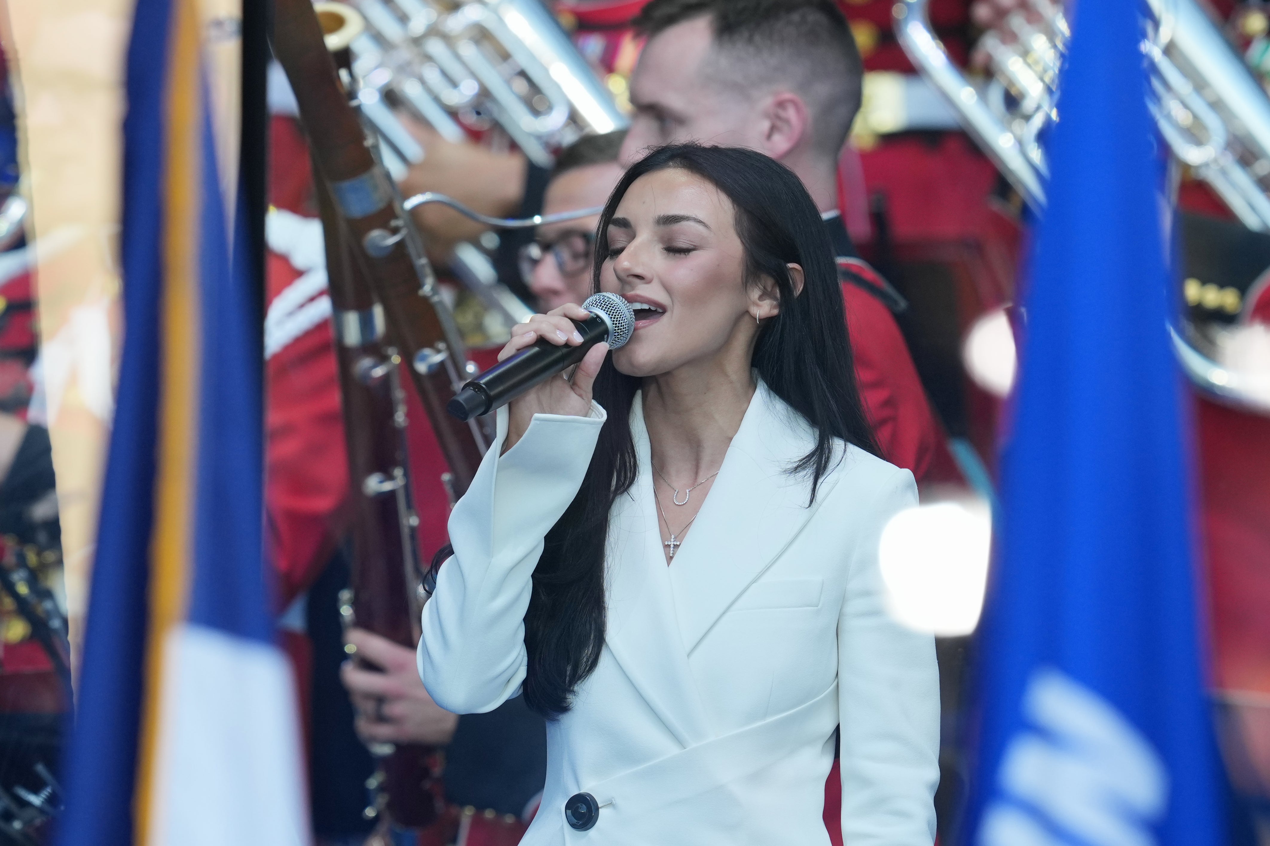 FBI Director Kash Patel’s girlfriend, Alexis Wilkins, sang the national anthem