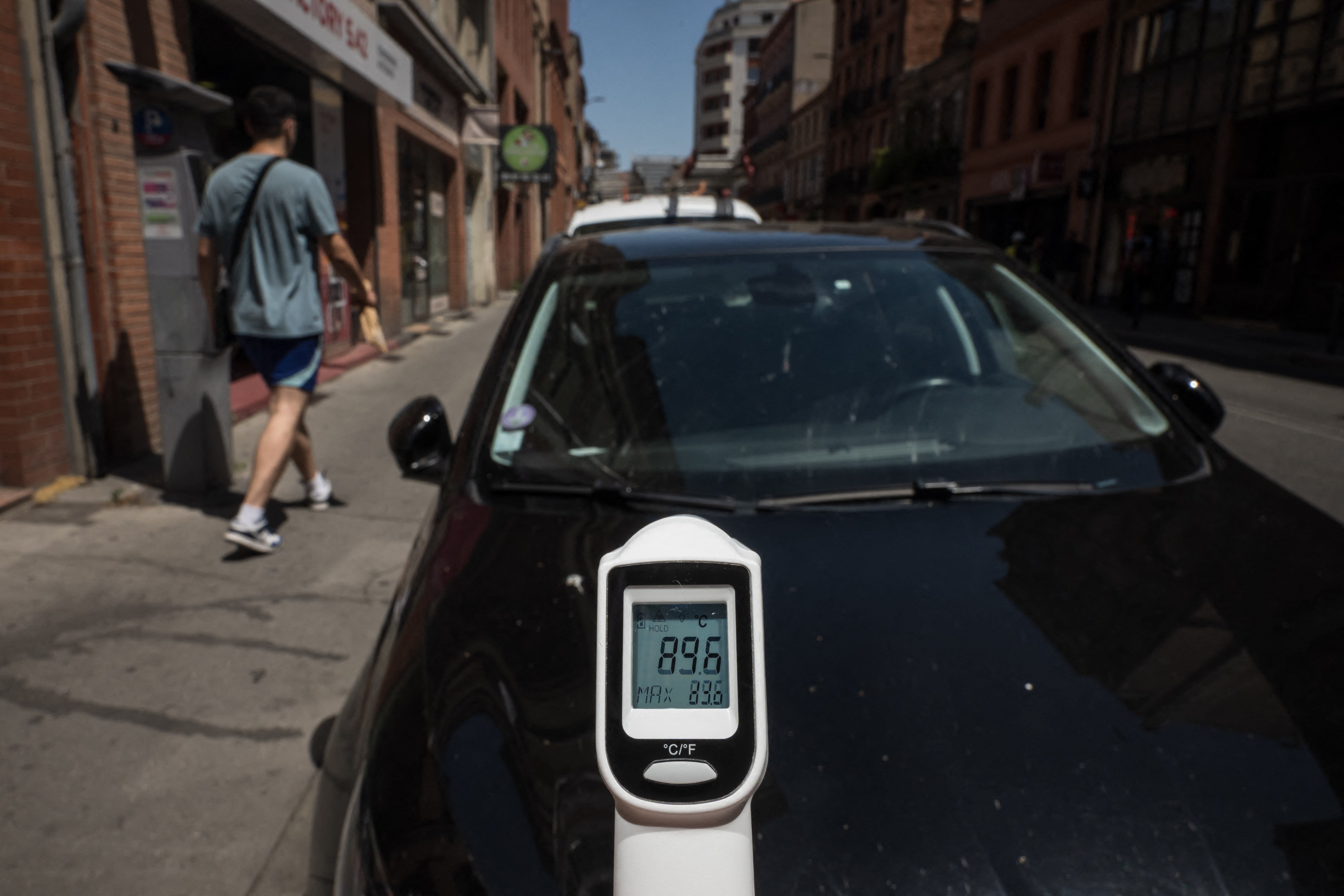 A thermometer shows the temperature of 89.6 degrees Celsius on a car in the French heatwave