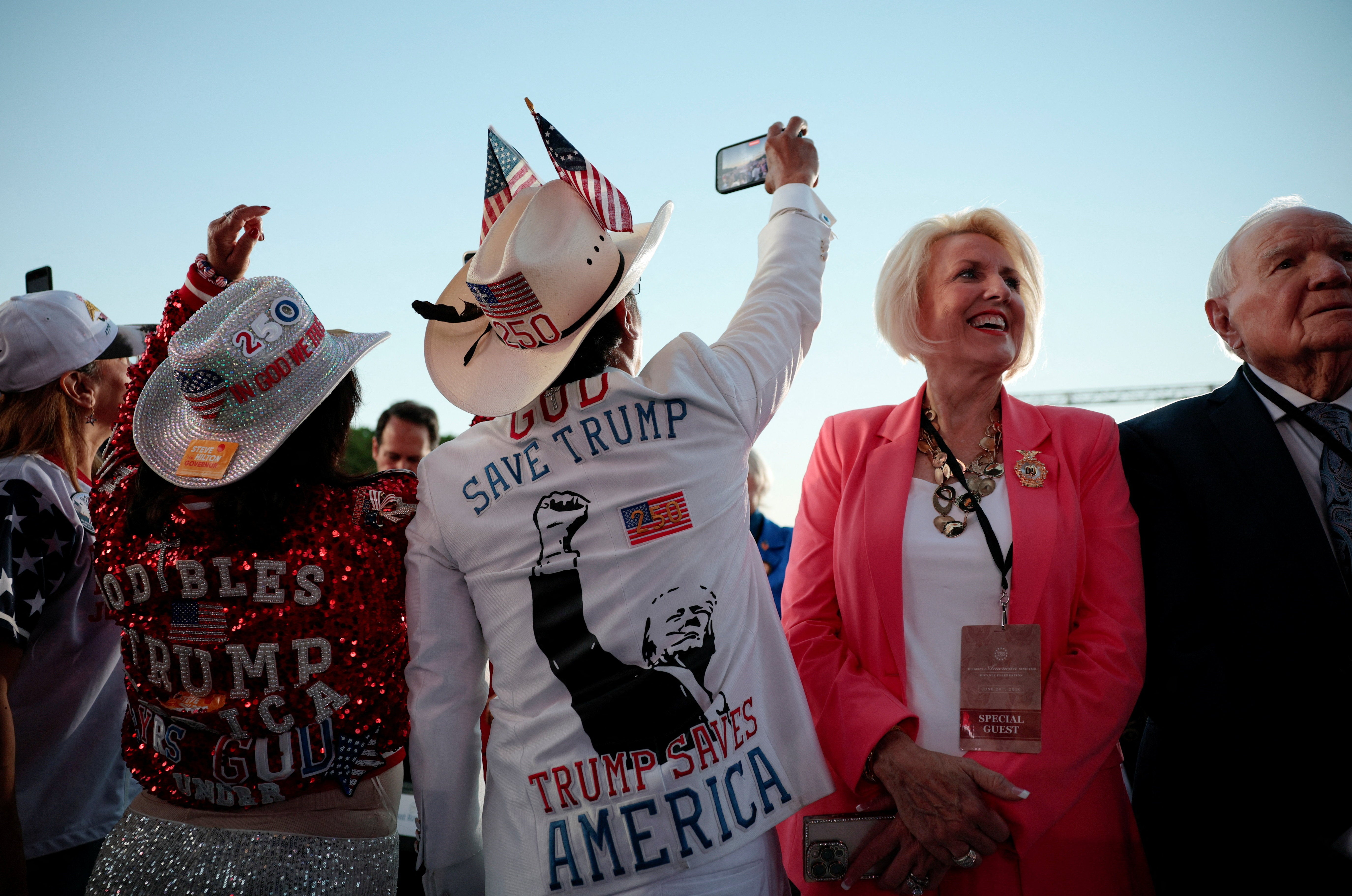 Many of the attendees were spotted wearing Trump-themed clothing, including a jacket that states: 'Trump saves America'