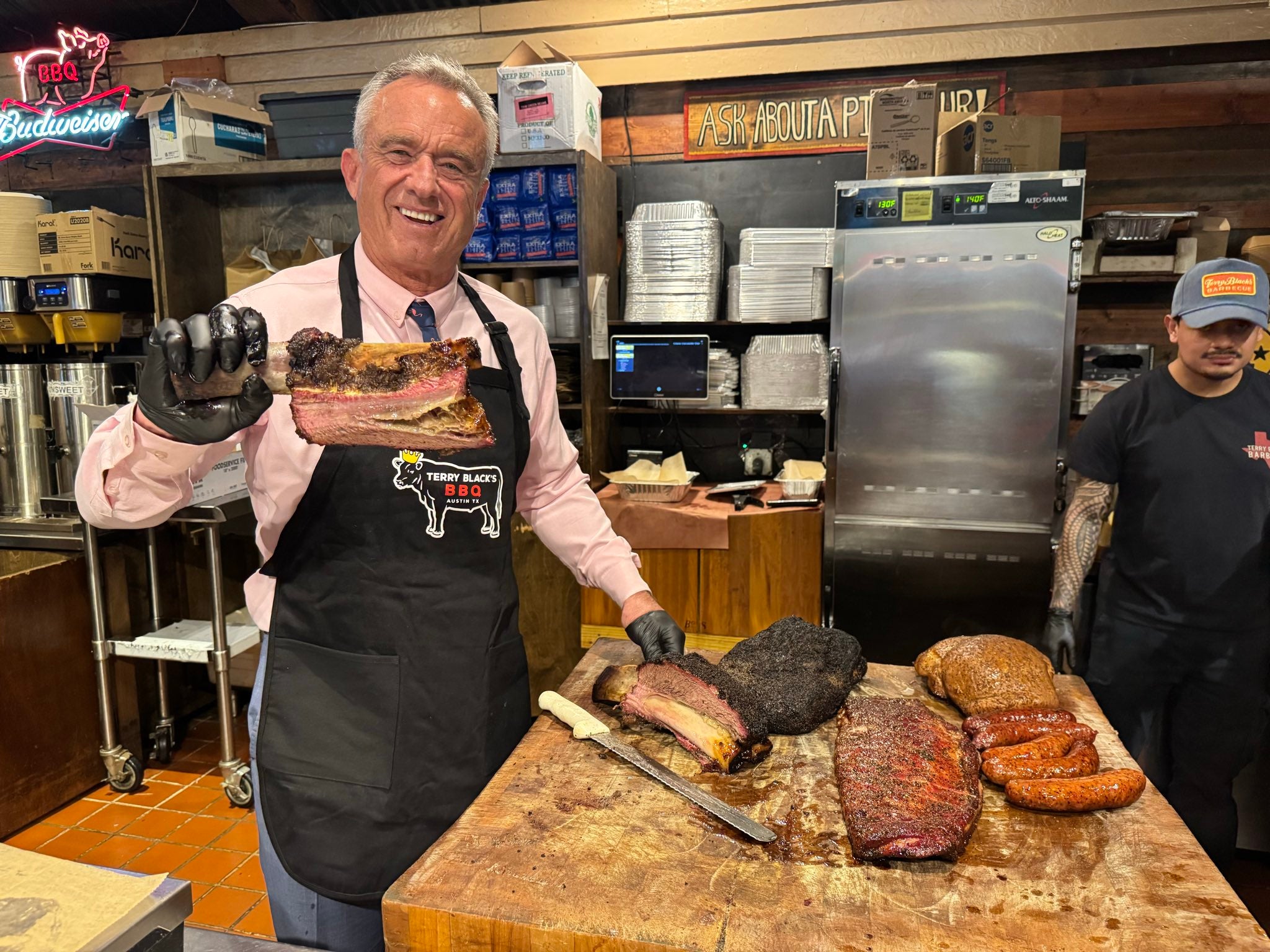 Health Sec. Robert F. Kennedy Jr. poses with meat at Terry Black’s Barbecue in Texas in this February photo posted to social media. Kennedy eats red meat for breakfast (Secretary Kennedy/X)
