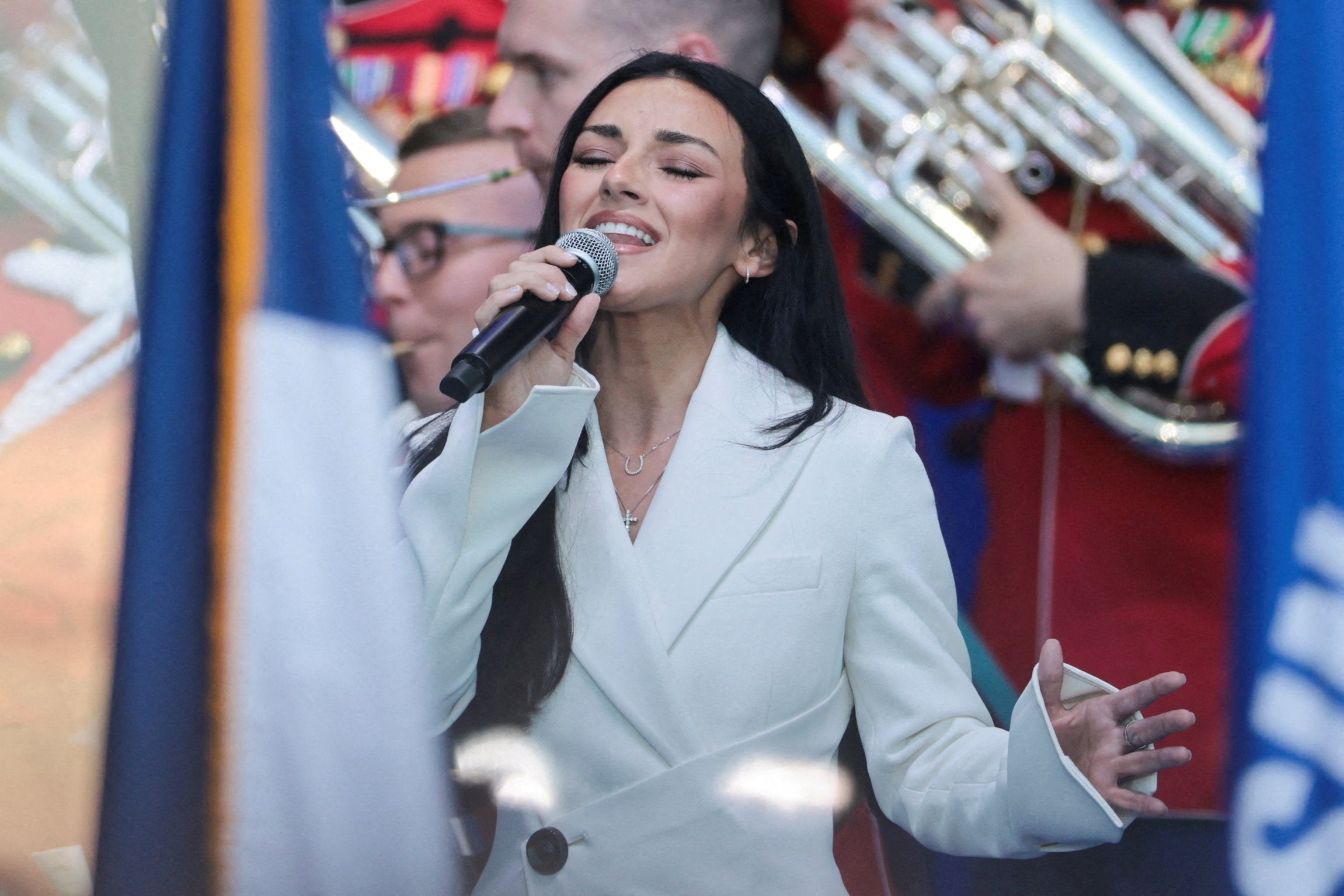 Kash Patel's girlfriend sings for Trump crowd and the internet brings the reviews | The Independent
