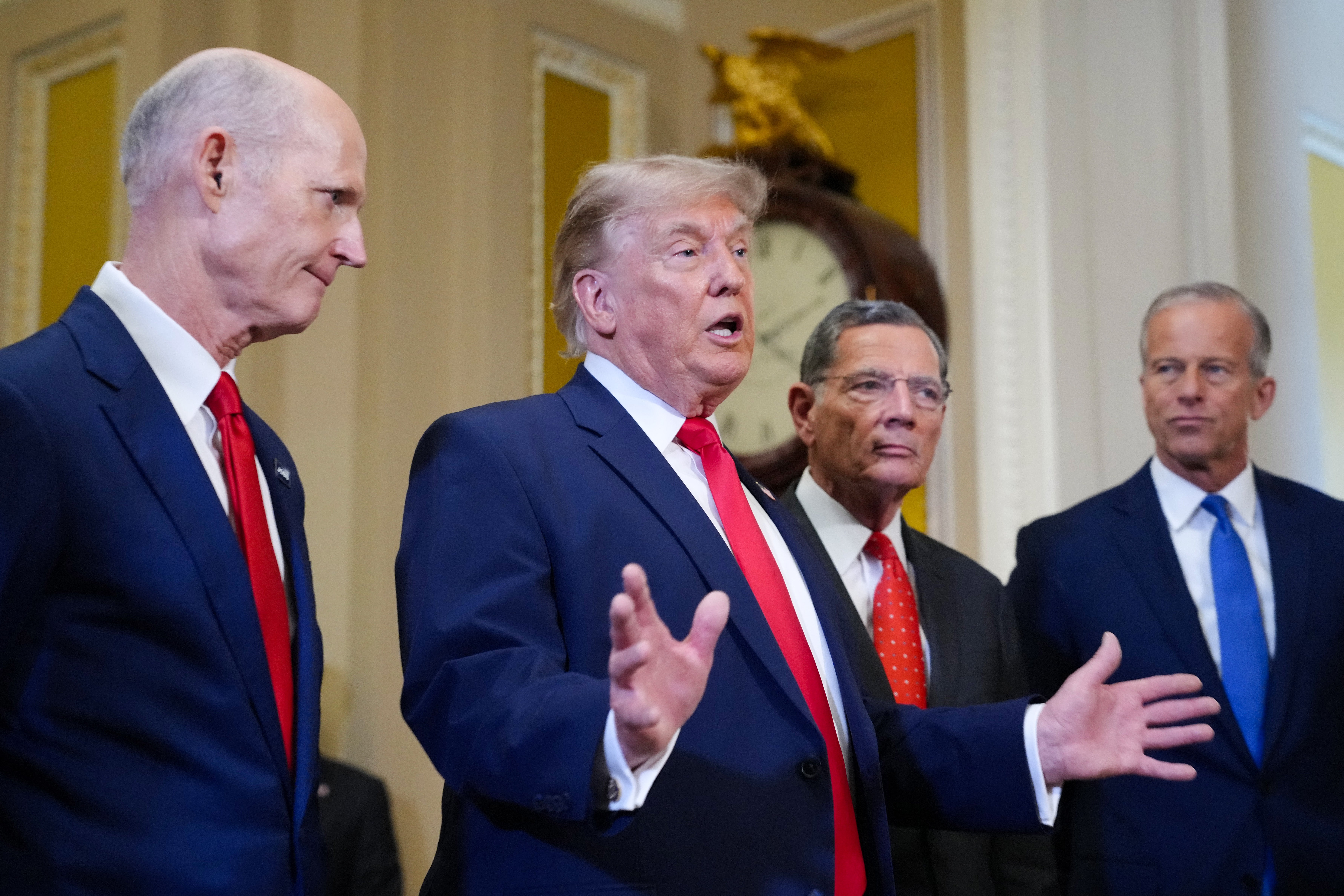 <p>Donald Trump speaks to the media on Wednesday, flanked by Senate Republican leadership</p>