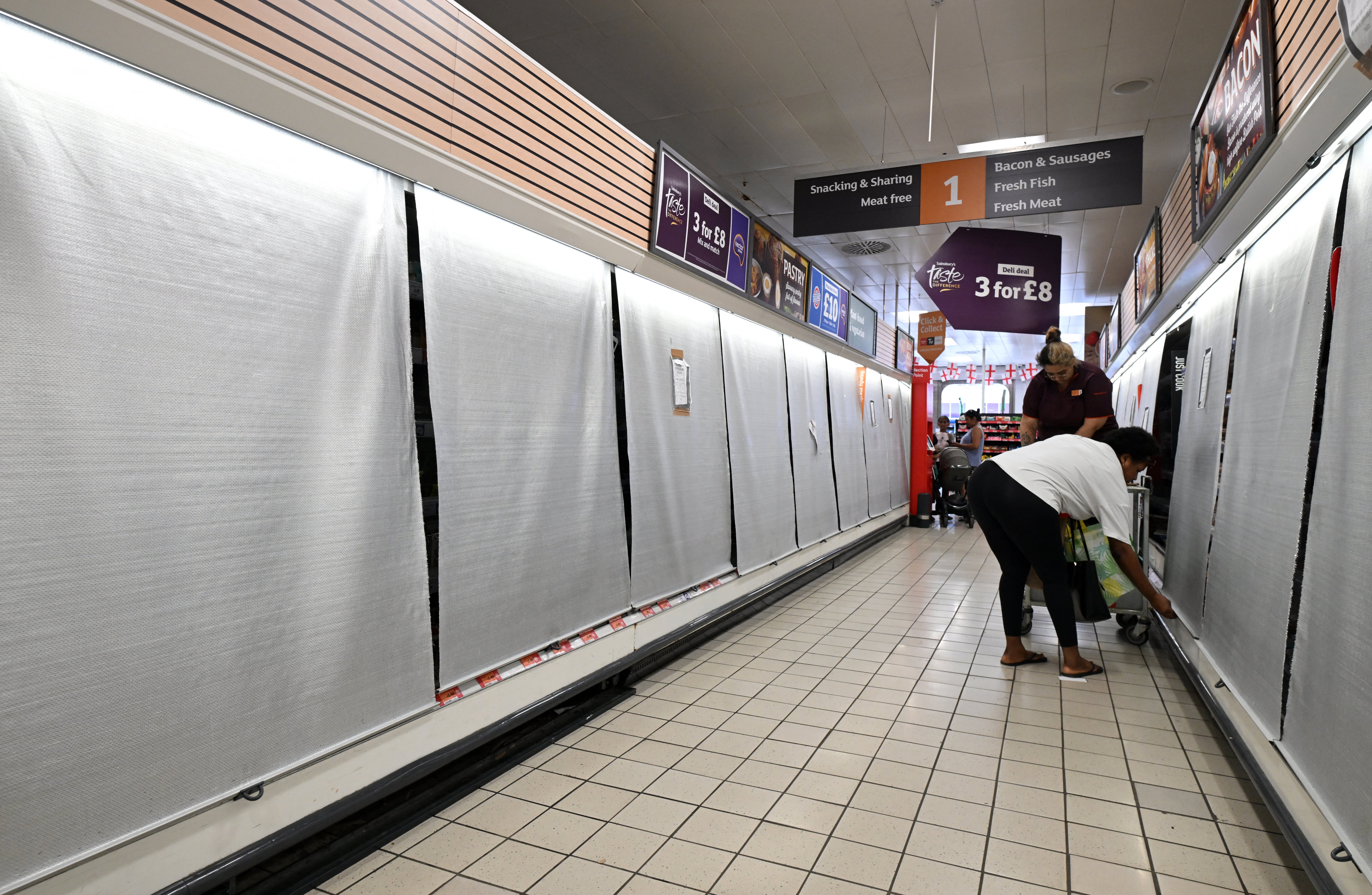 Shops were forced to cover fridges to keep items cool during the heat