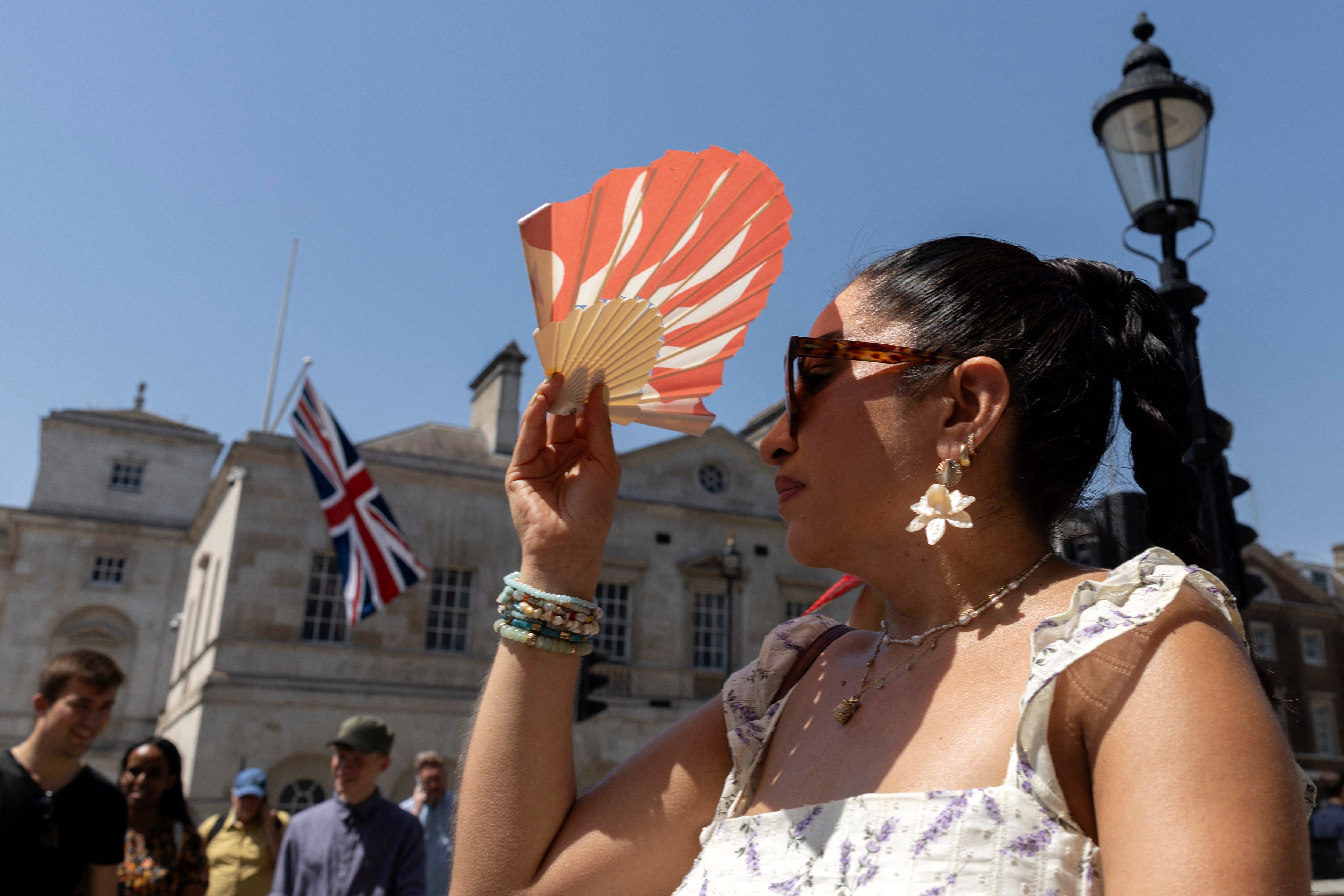 The country sweltered in exceptionally hot and humid weather for a second consecutive day on Thursday, with rare red weather warnings continuing into Friday (AFP/Getty)