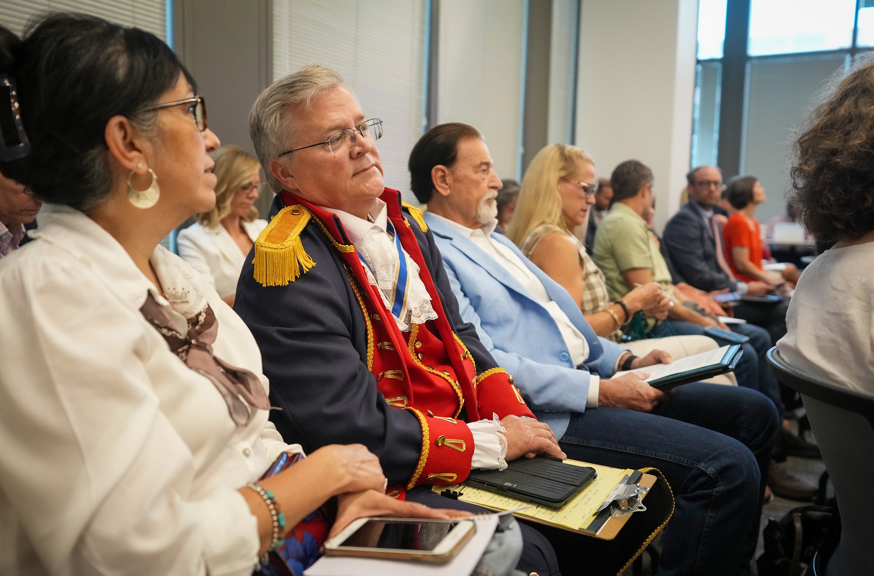 Robert Mearns of Granbury, dressed as an American Revolutionary War soldier, listens during a meeting on proposed social studies standards