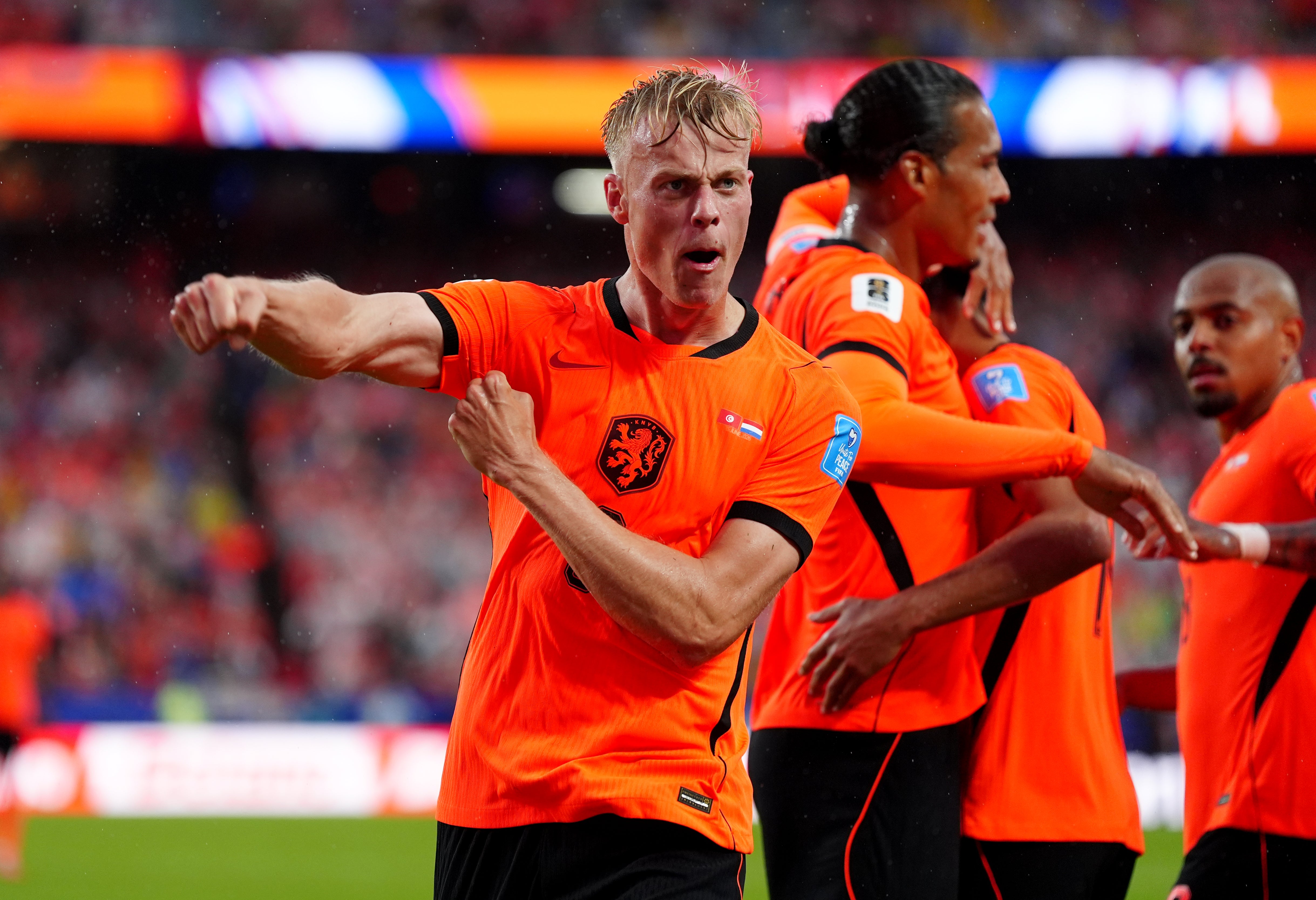 Netherland's Jan Paul van Hecke celebrates scoring their sides third goal