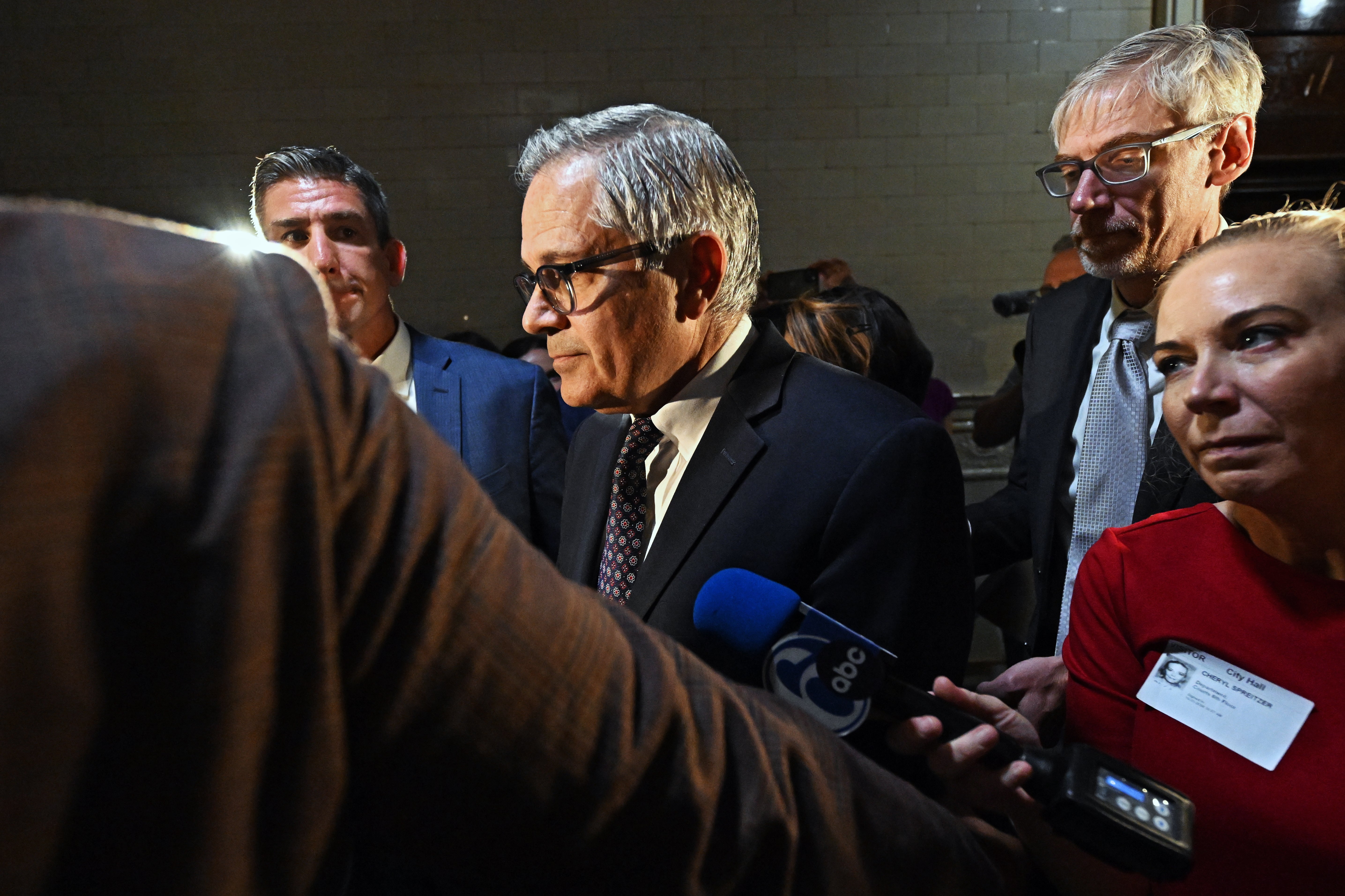 Philadelphia district attorney Larry Krasner (center) walks from the courtroom at city hall after a hearing over a lawsuit he filed against Elon Musk and his $1M giveaway petition contest on October 31, 2024