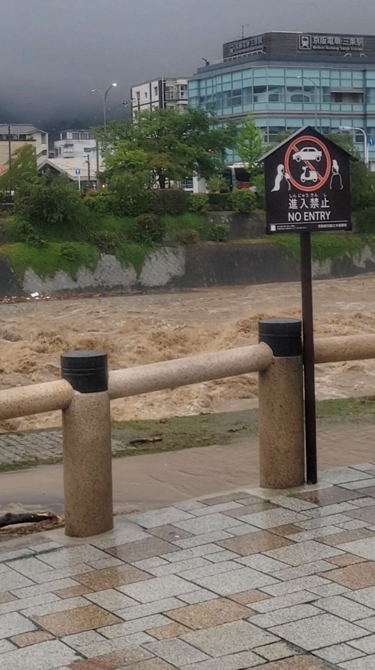 The Kamo river is flooded after heavy rainfall in Kyoto, Japan