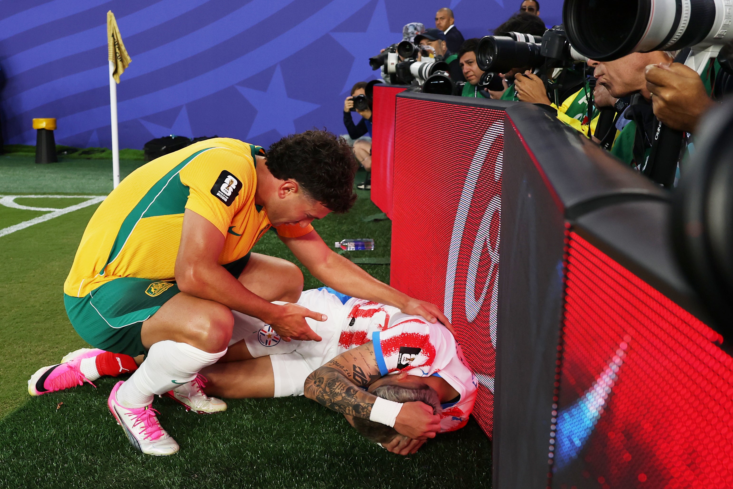 Paraguay’s Julio Ensico crashed into an advertising hoarding during their draw with Australia