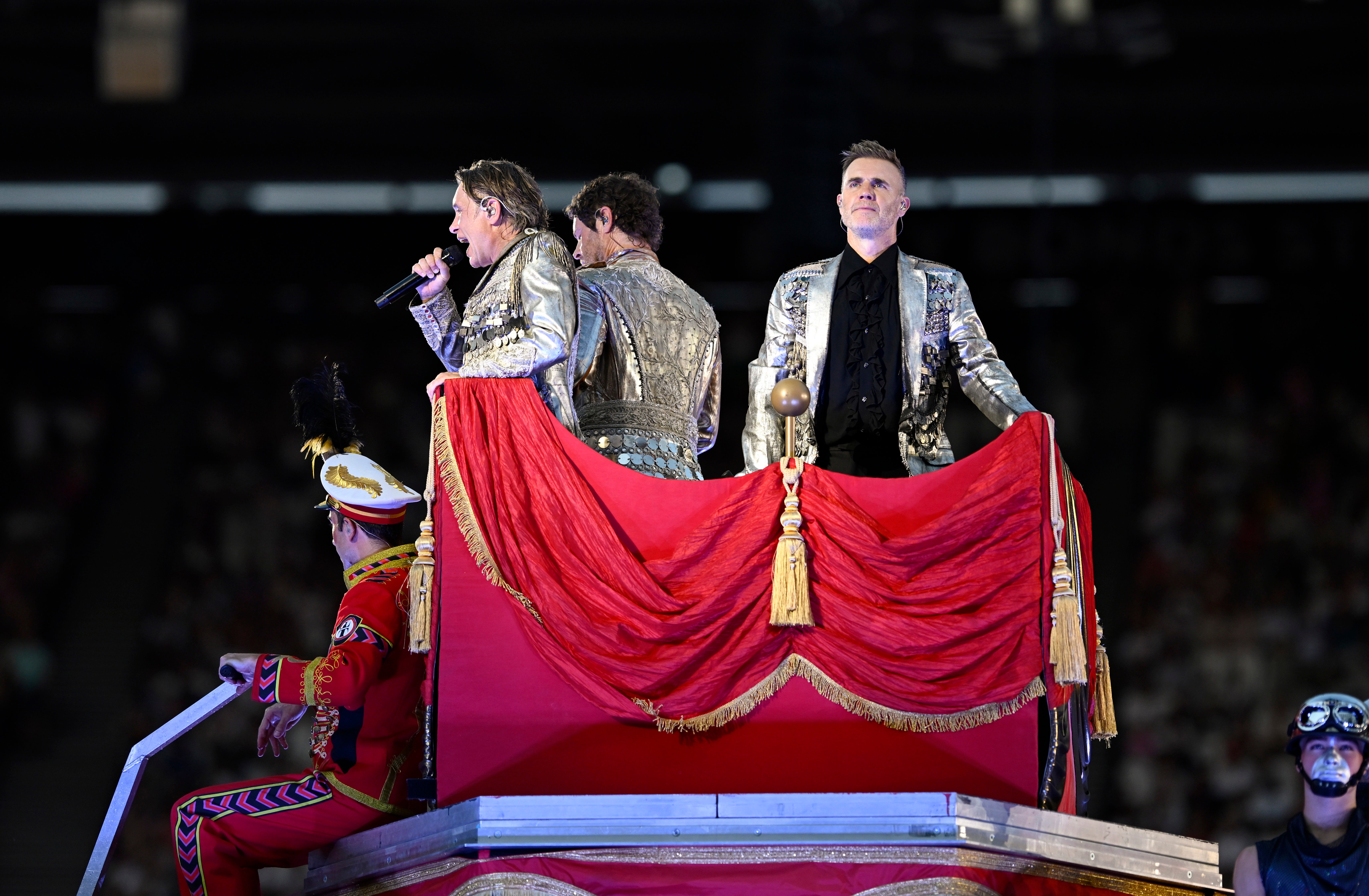 Take That atop the mechanical elephant (Getty)