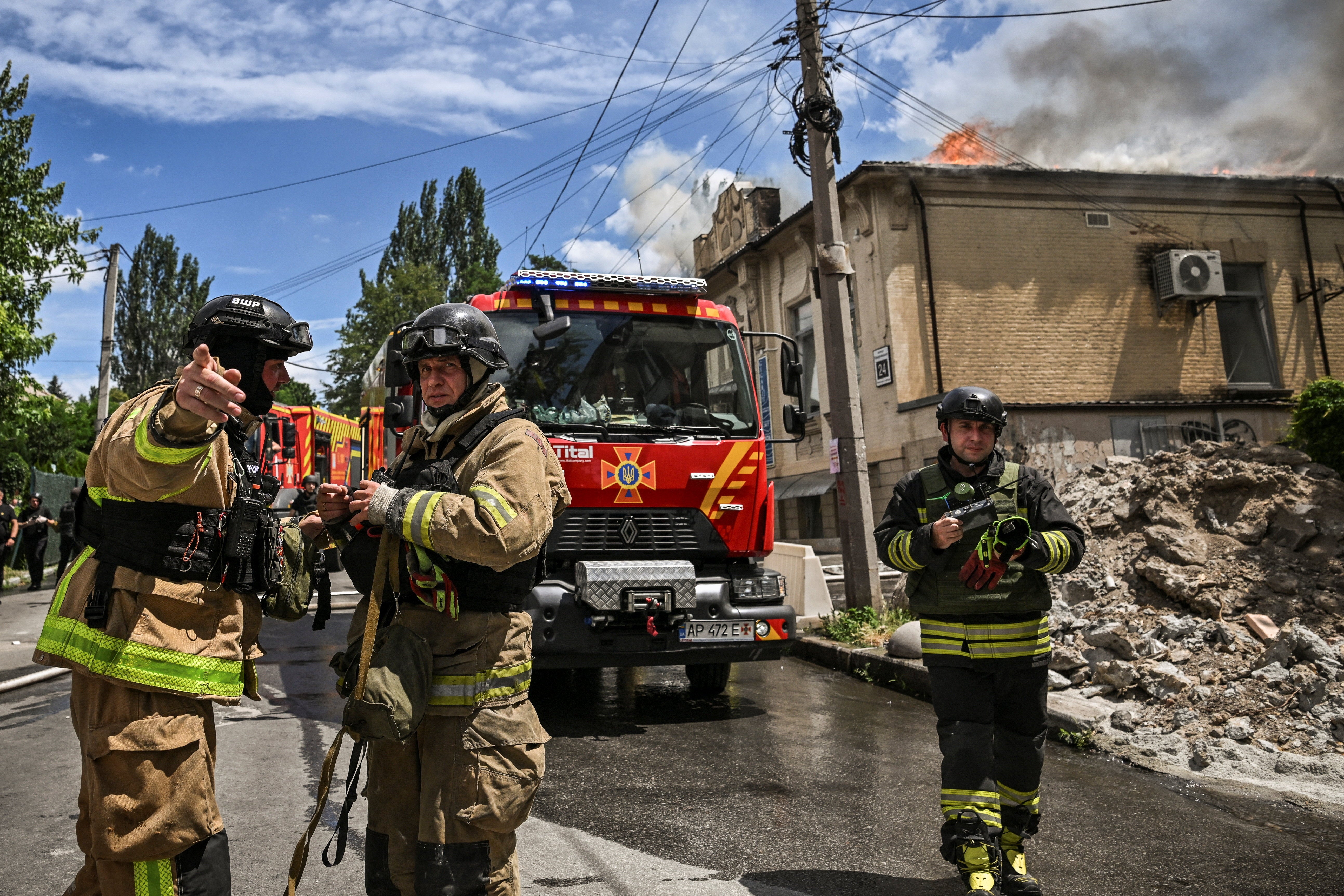 Firefighters work at the site of a Russian military strike, amid Russia's attack on Ukraine, in Zaporizhzhia