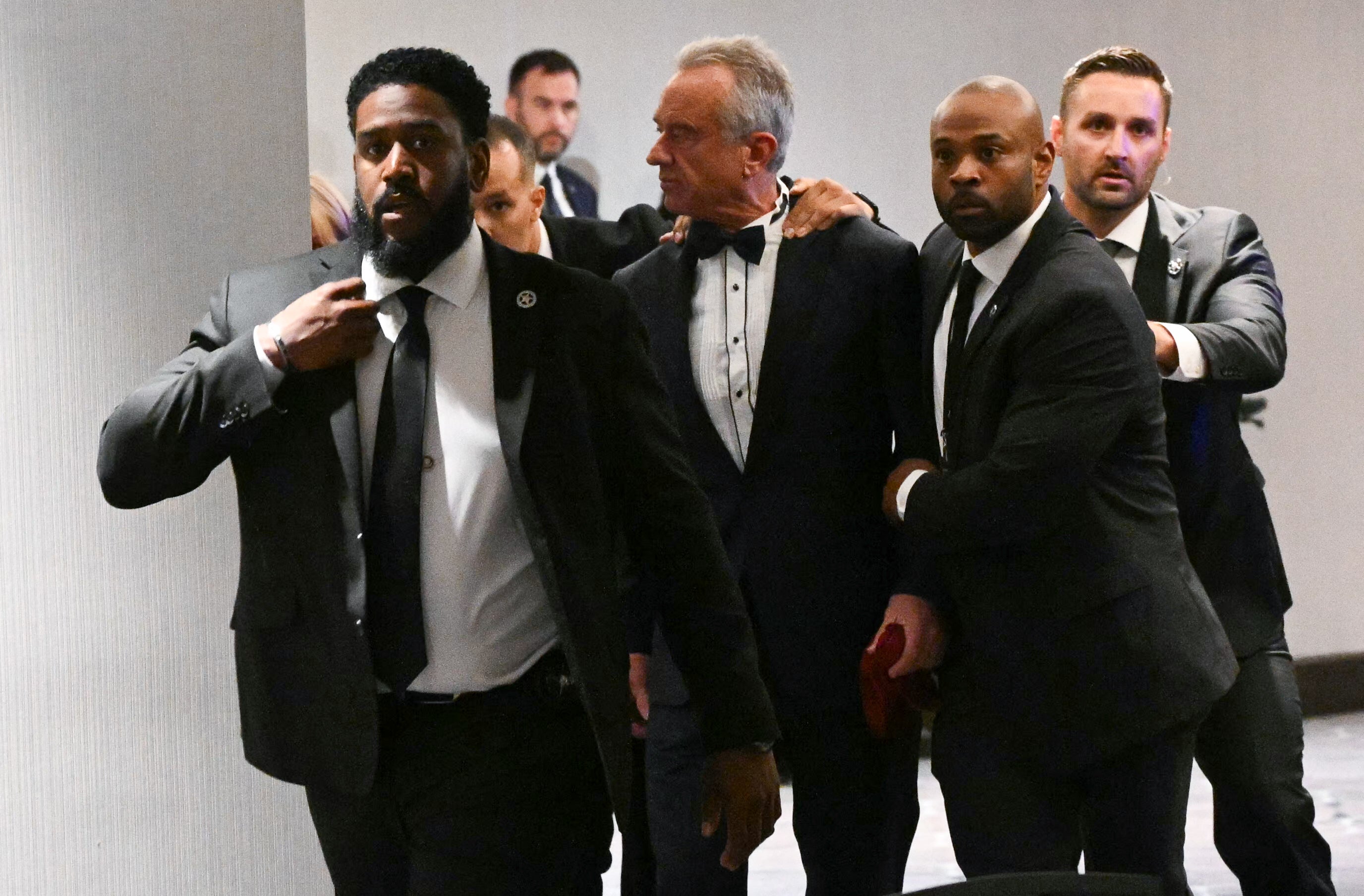 Trump and his Cabinet members were rushed to safety as Secret Service confronted the gunman