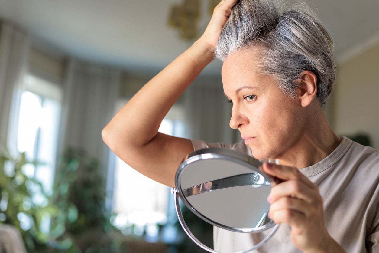 Grey hair is more porous and “more exposed” to external factors. (Getty Images)