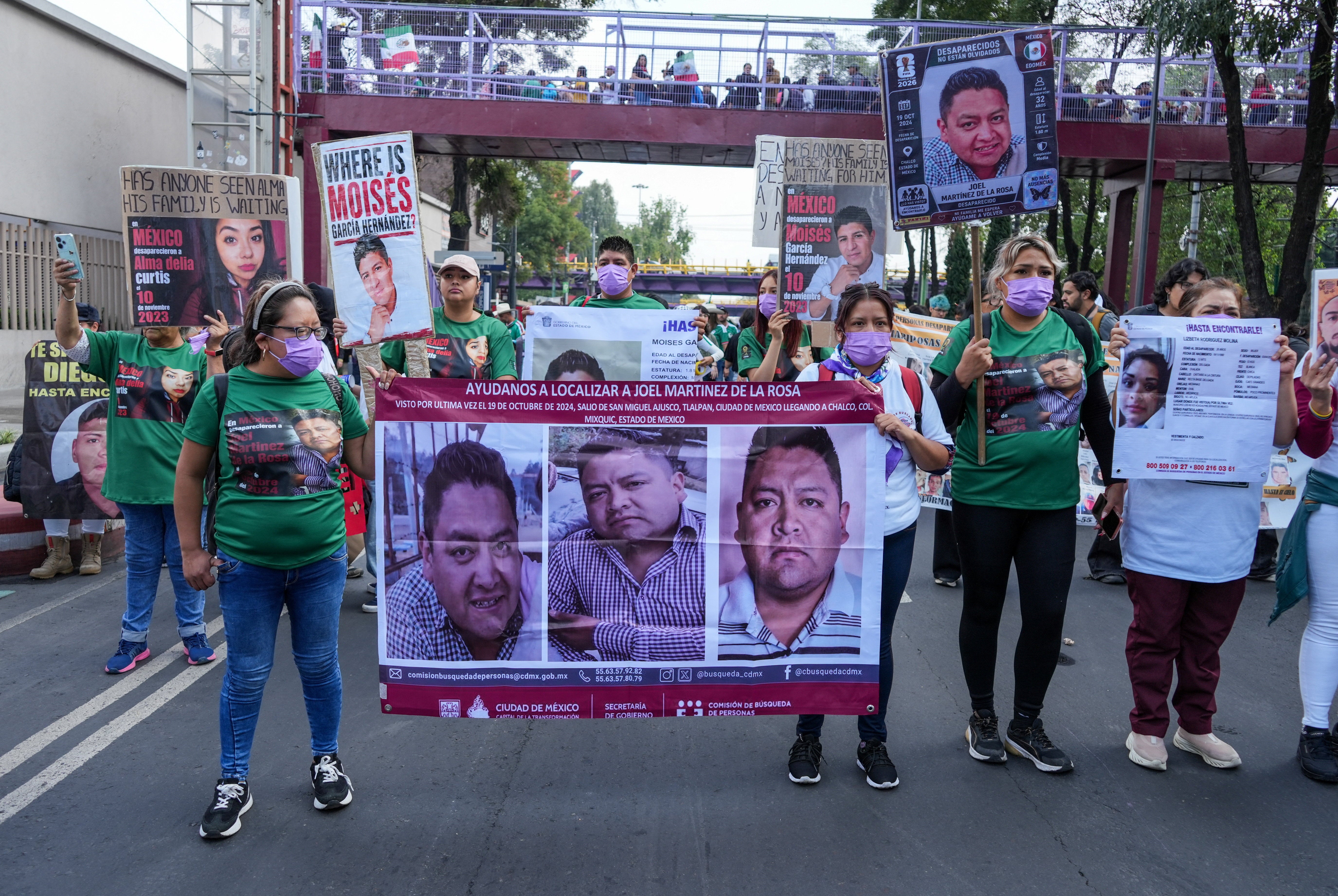 Search collectives for missing people, whose sons and daughters are victims of Mexico's drug cartels, take part in a protest march ahead of the World Cup’s opening match in Mexico City