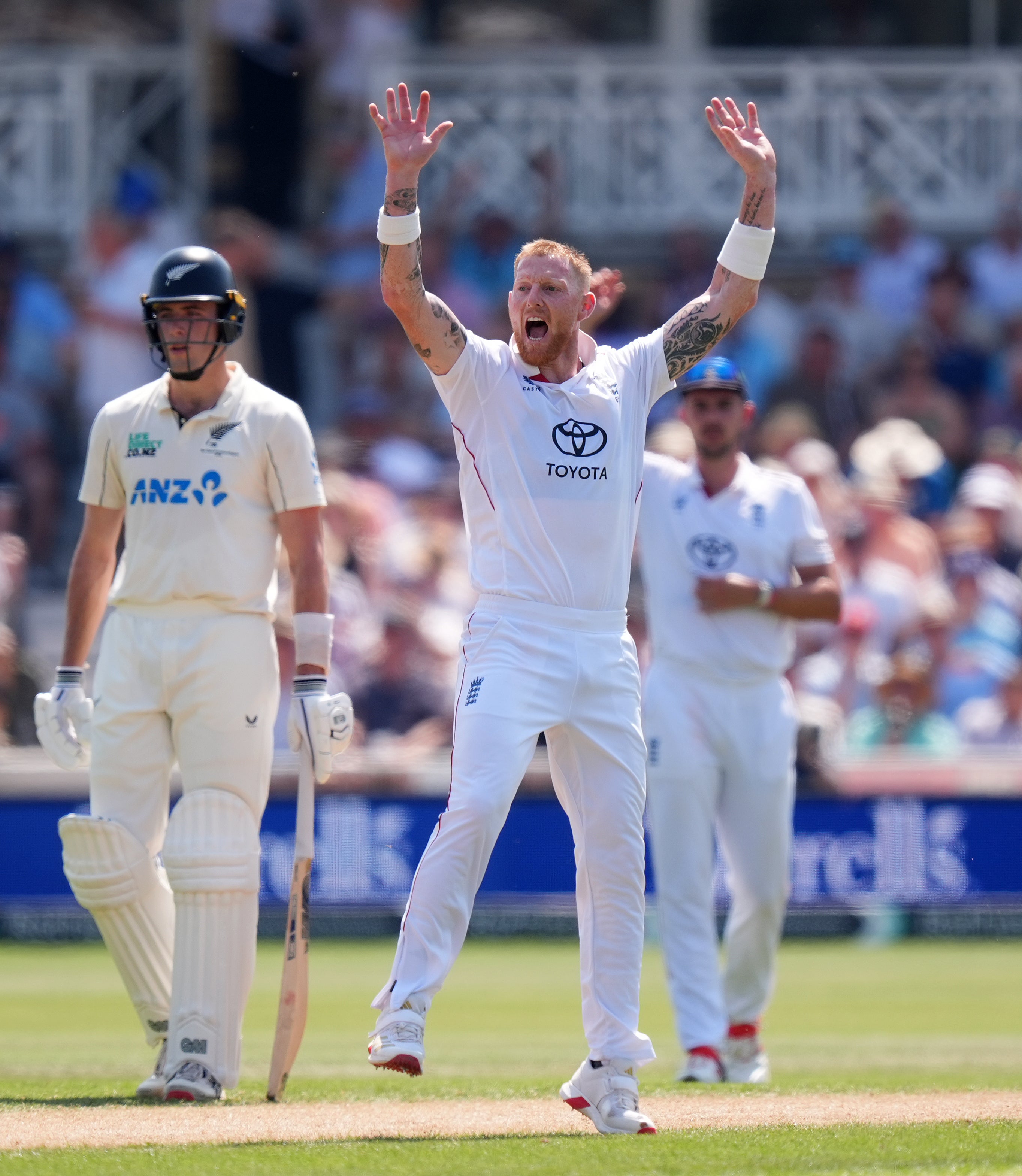 England’s Ben Stokes celebrates taking the wicket of New Zealand’s Daryl Mitchell (PA) (PA Wire)