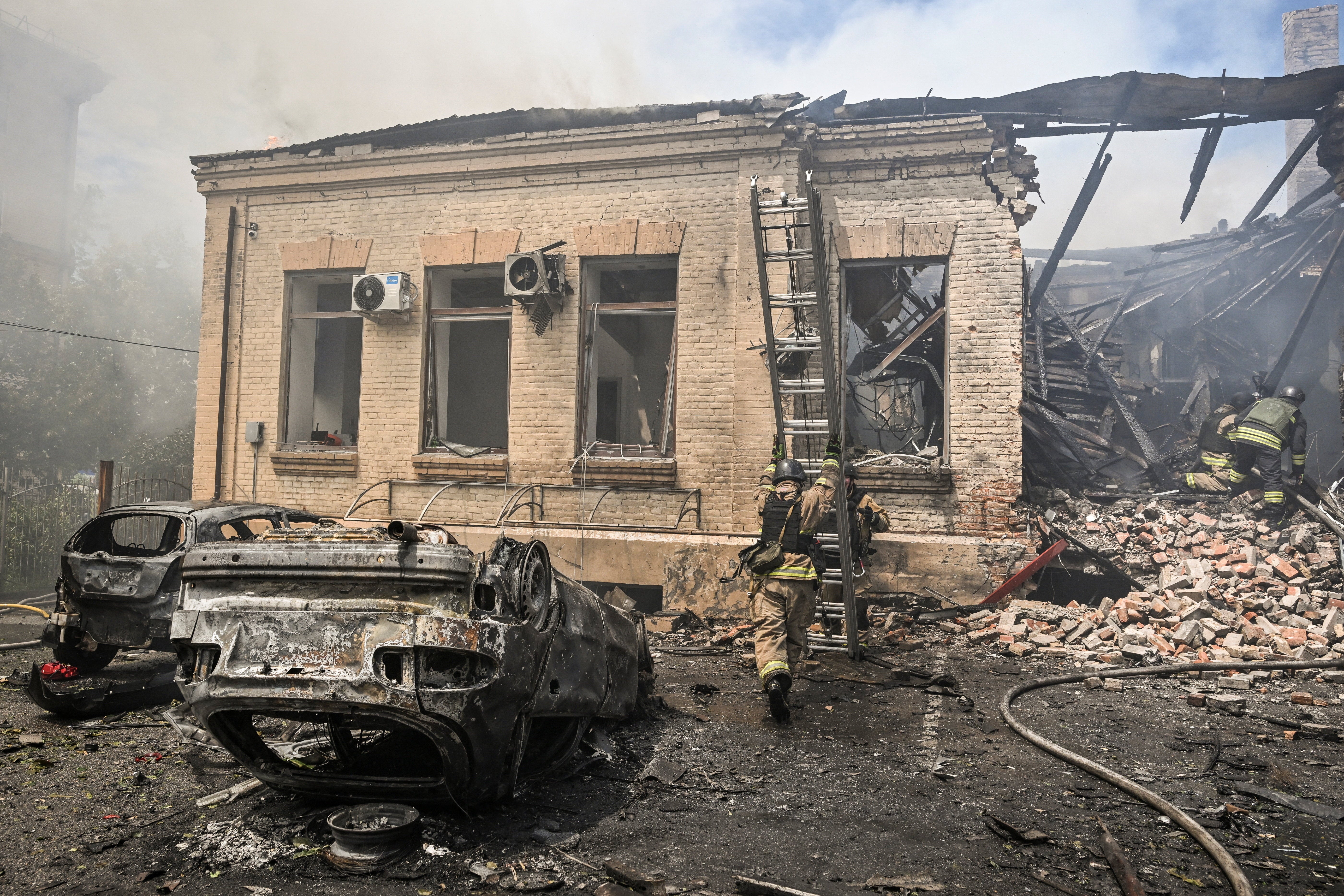 Firefighters work at the site of a Russian military strike, amid Russia's attack on Ukraine