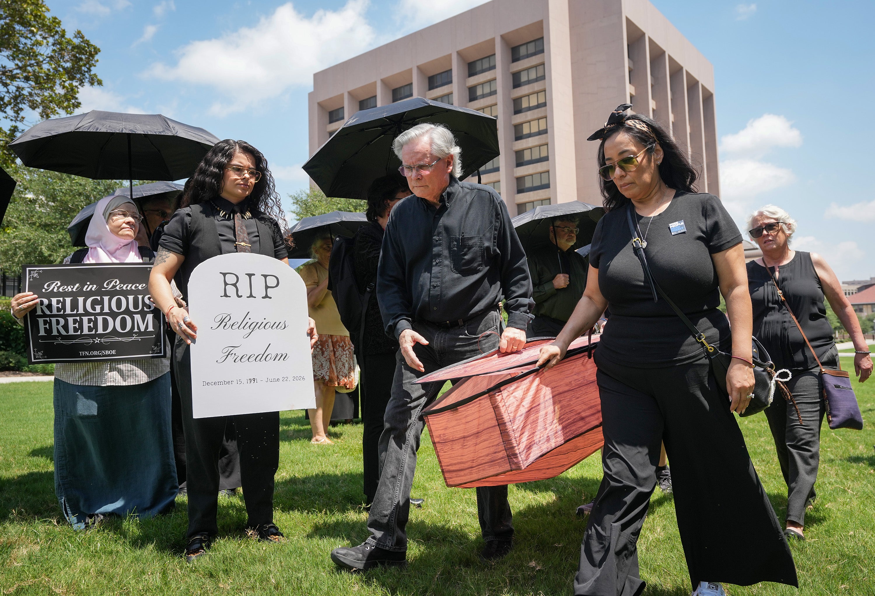 People participate in an interfaith funeral-themed protest in Austin, Texas, last month. The Texas board of education has controversially voted to require Bible stories to be taught from kindergarten through to the final year of high school