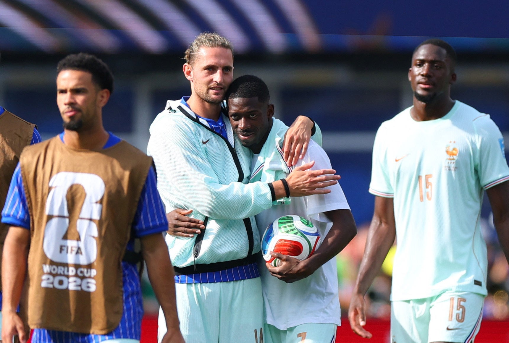 France's Ousmane Dembele celebrates with Adrien Rabiot after picking up the match ball thanks to his hat-trick