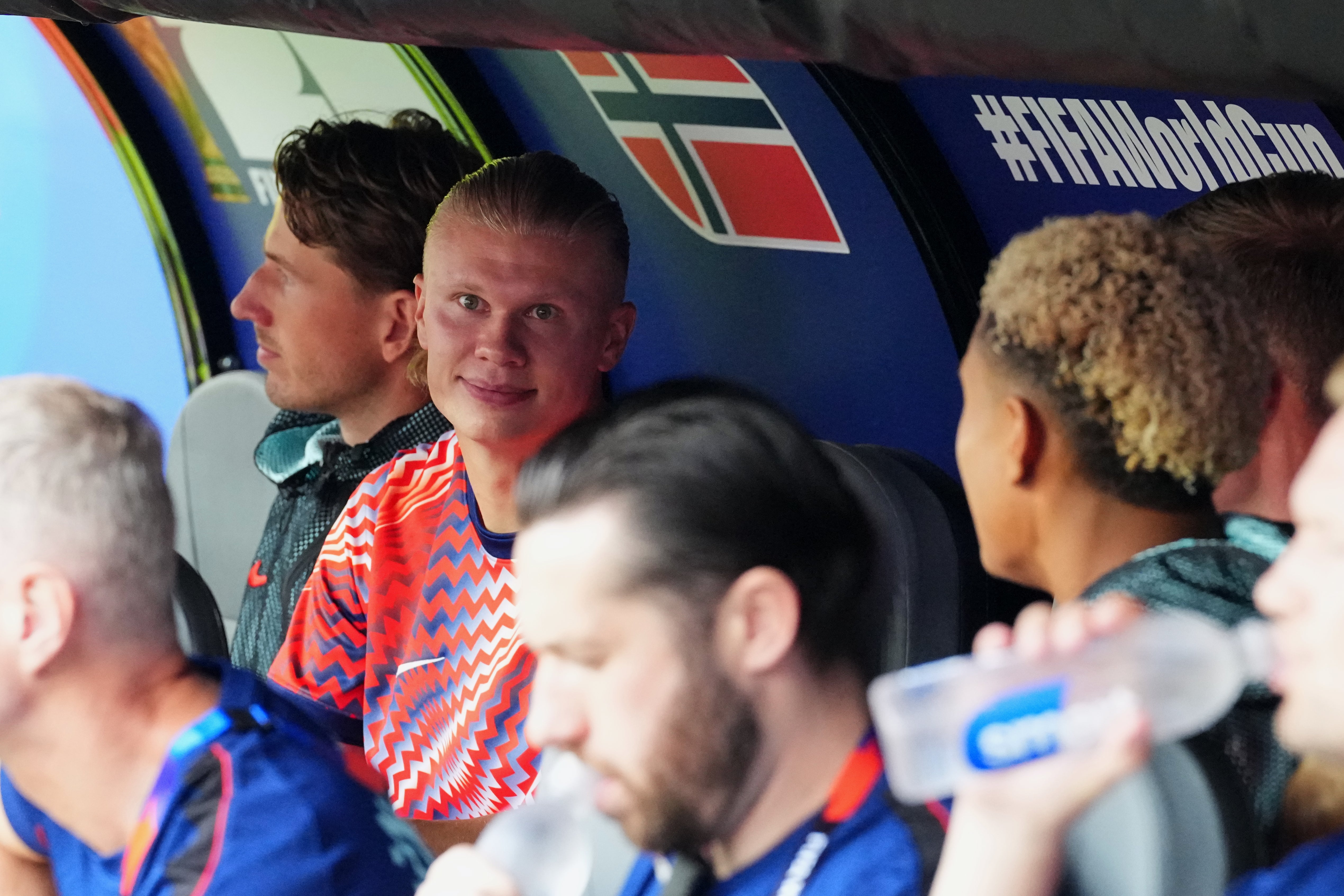 Haaland watches on from the dugout (AP)