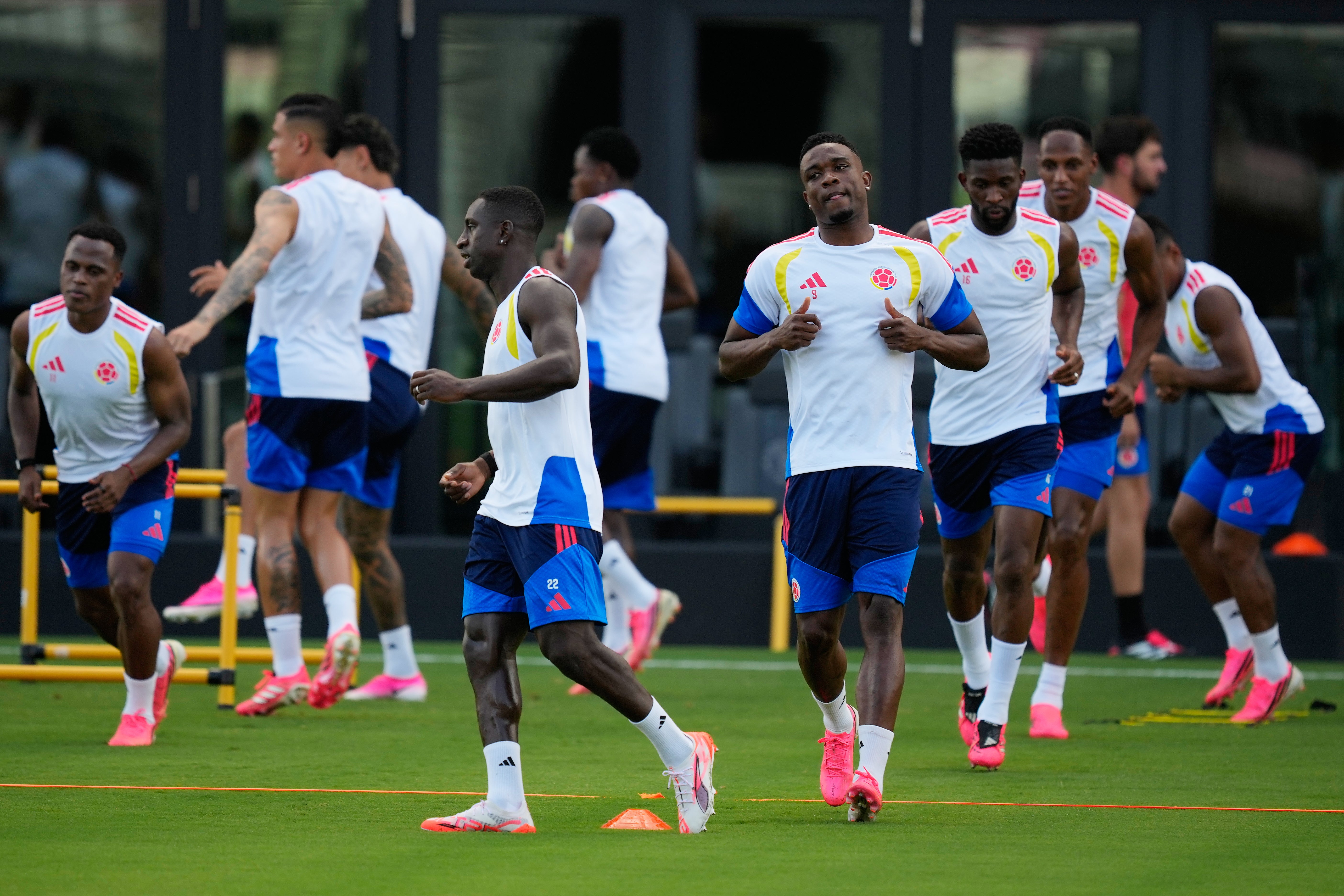 Colombia players during training wear pink boots