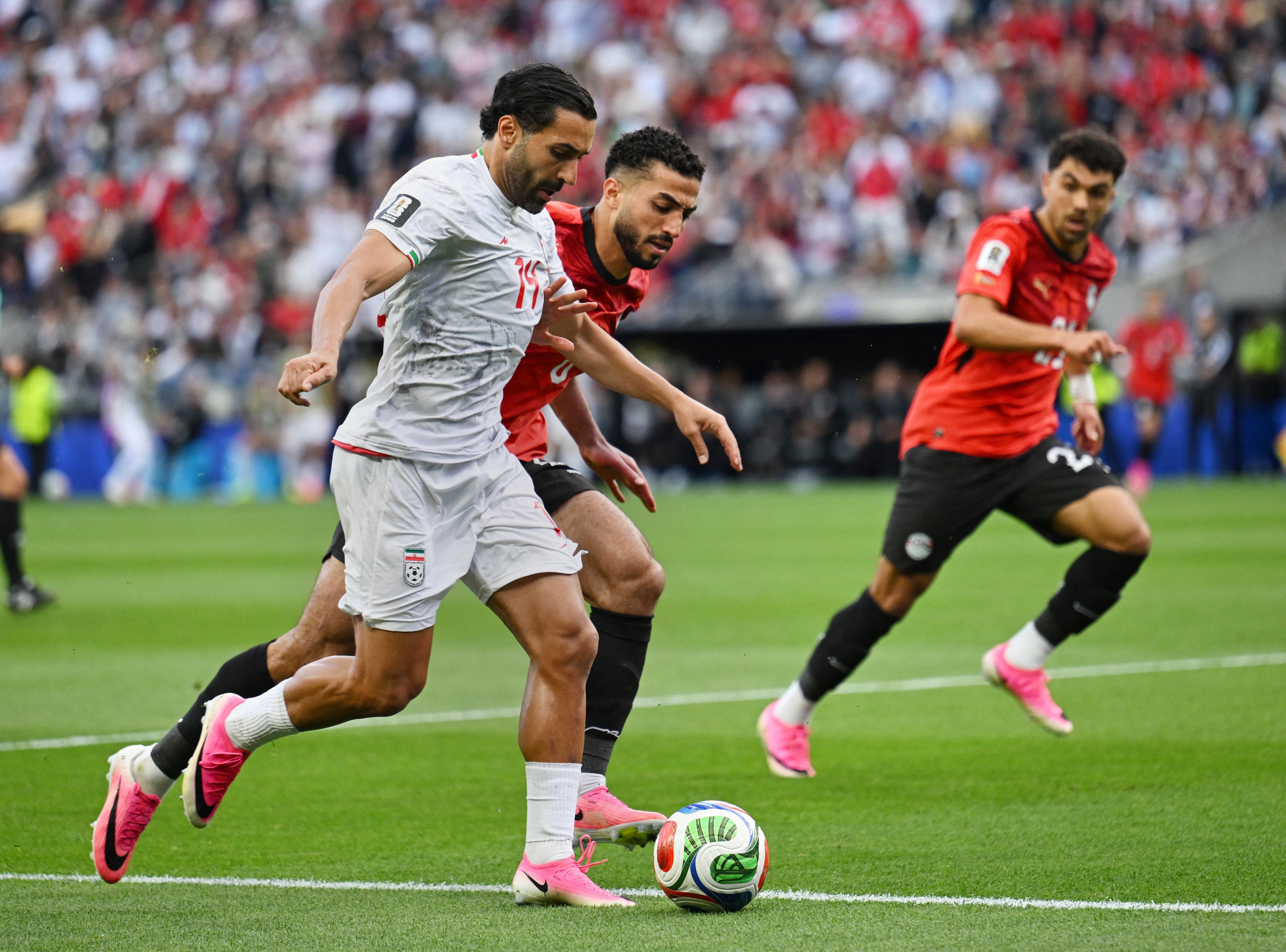 Iran's Saman Ghoddos in action with Egypt's Mohamed Abdelmoniem