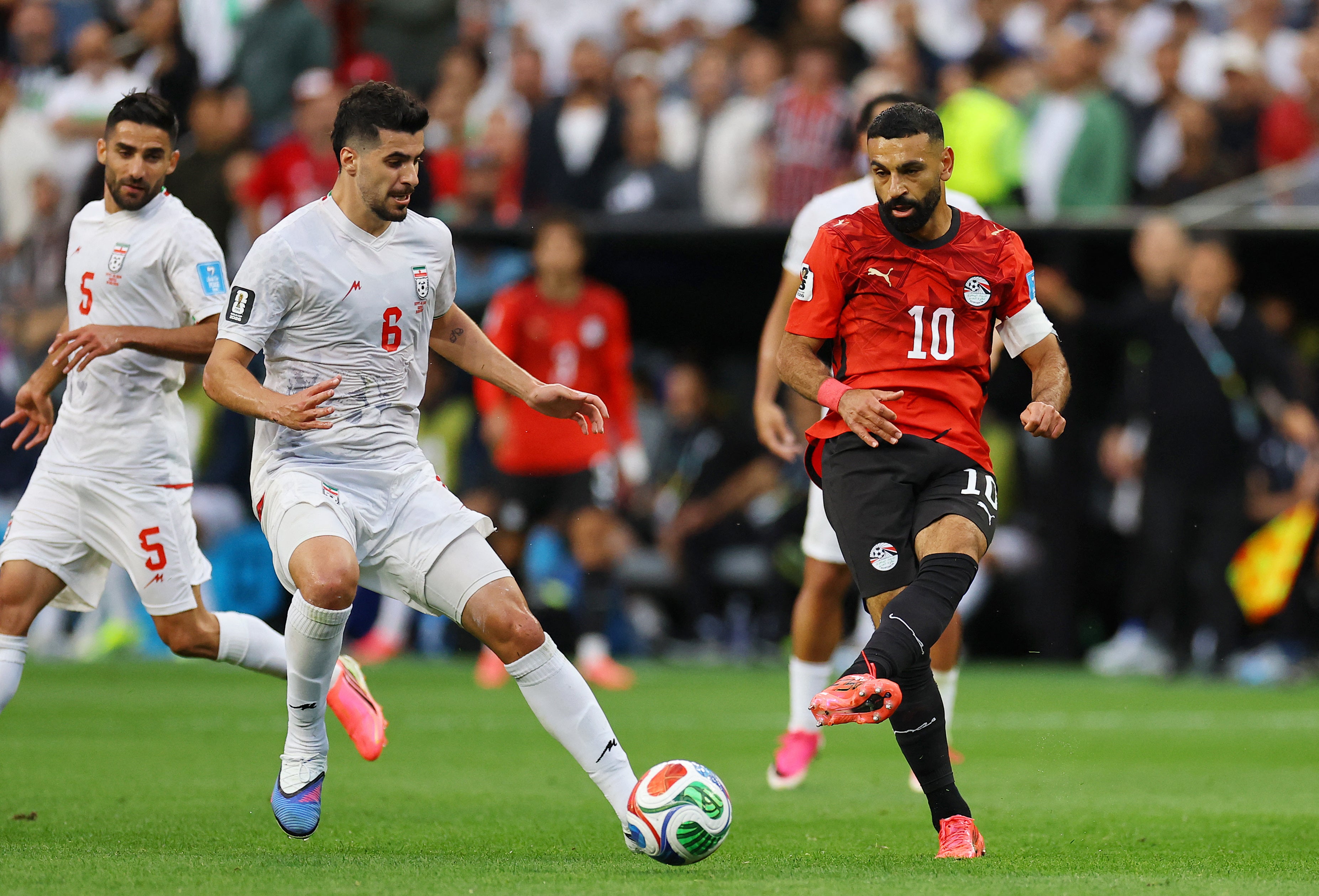 Egypt's Mohamed Salah in action with Iran's Saeid Ezatolahi