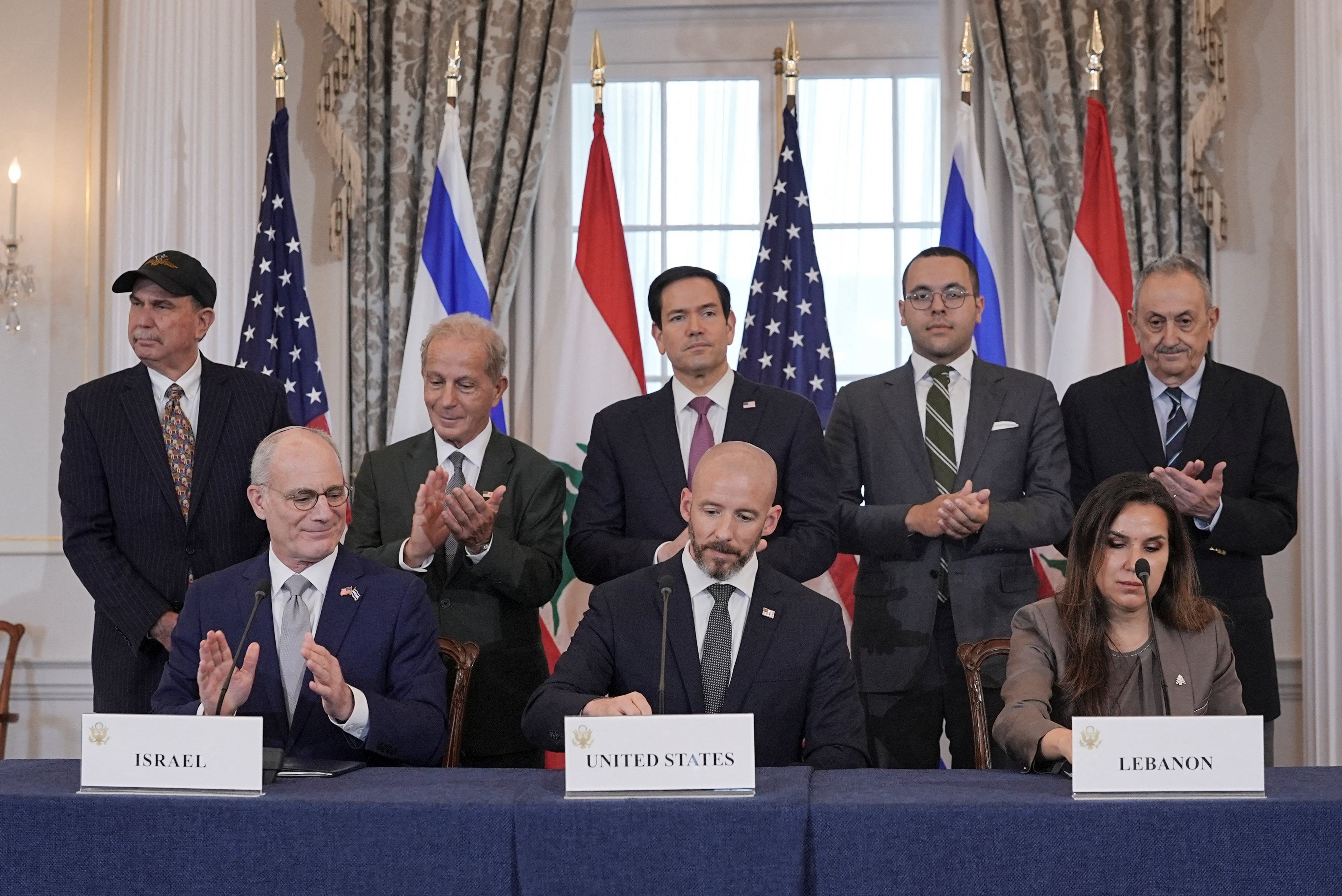 US secretary of state Marco Rubio and Israel's ambassador to the US Yechiel Leiter applaud after signing a framework agreement between Israel and Lebanon with State Department counsellor Daniel Holler and Lebanon's ambassador Nada Hamadeh in Washington on 26 June 2026