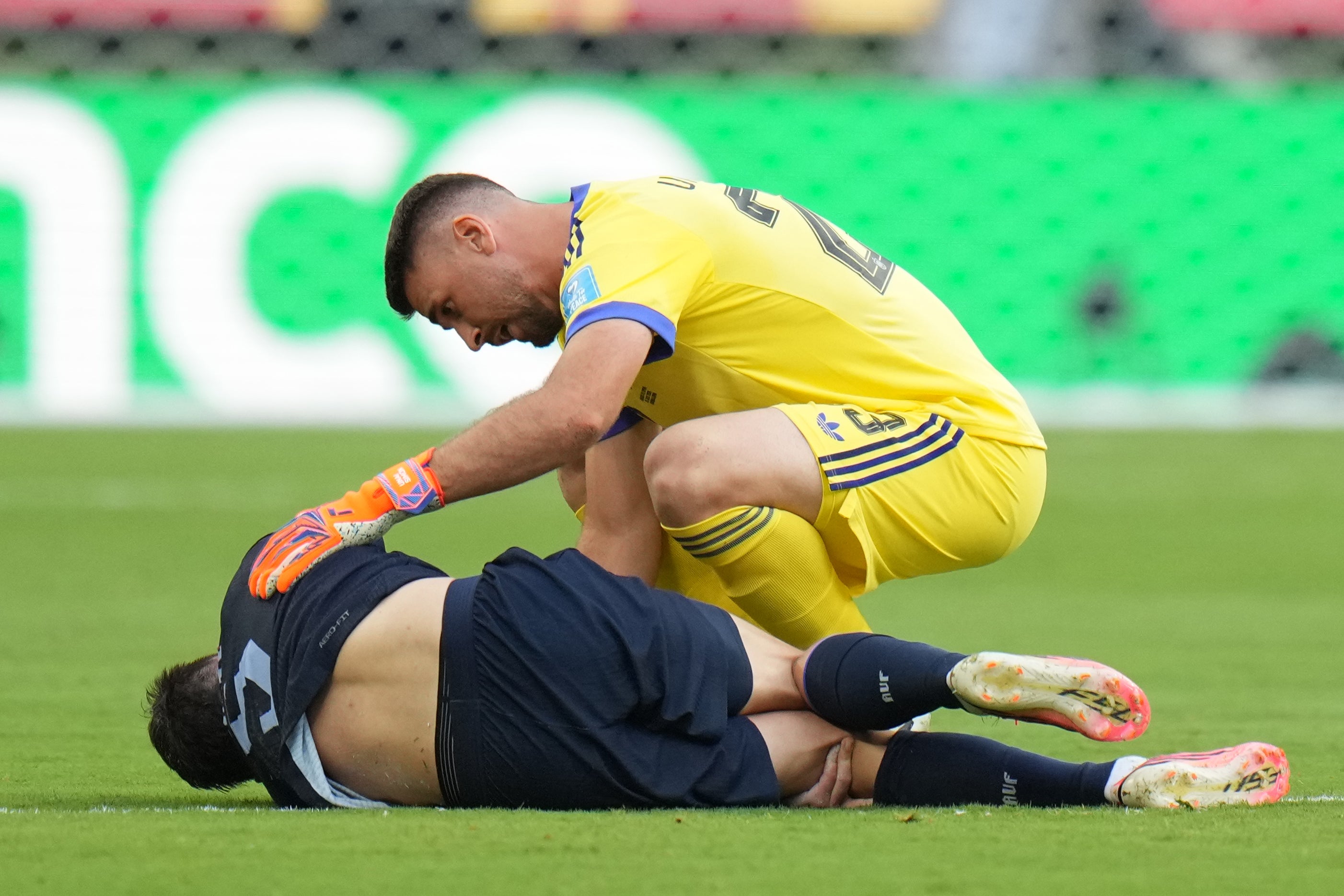 Spain goalkeeper Unai Simon checking on Ugarte