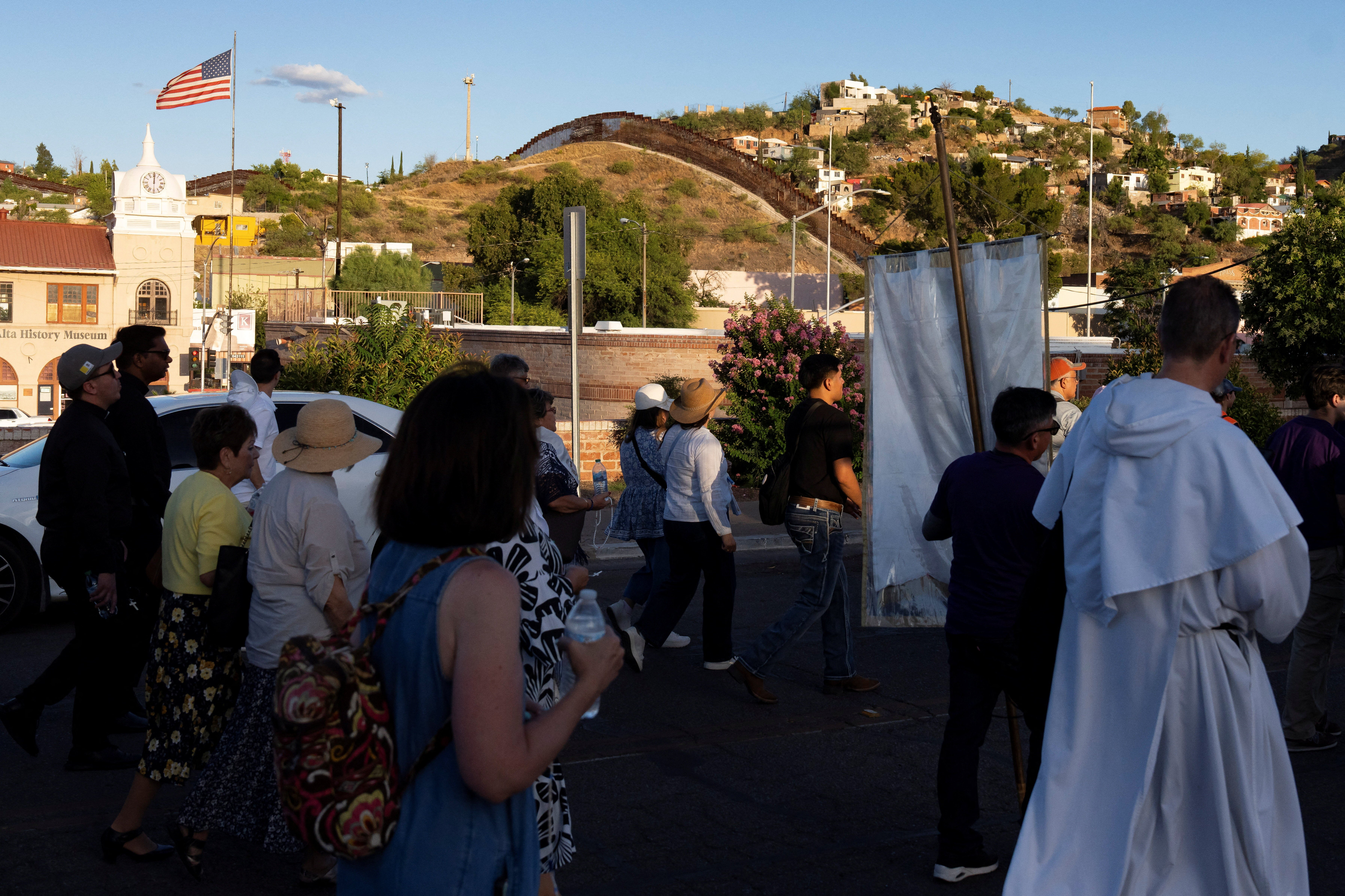 Congregants carry rosaries as they make their pilgrimage across the U.S.-Mexico border during Border Mass 250 in Nogales, Arizona, U.S. June 26, 2026. REUTERS/Rebecca Noble