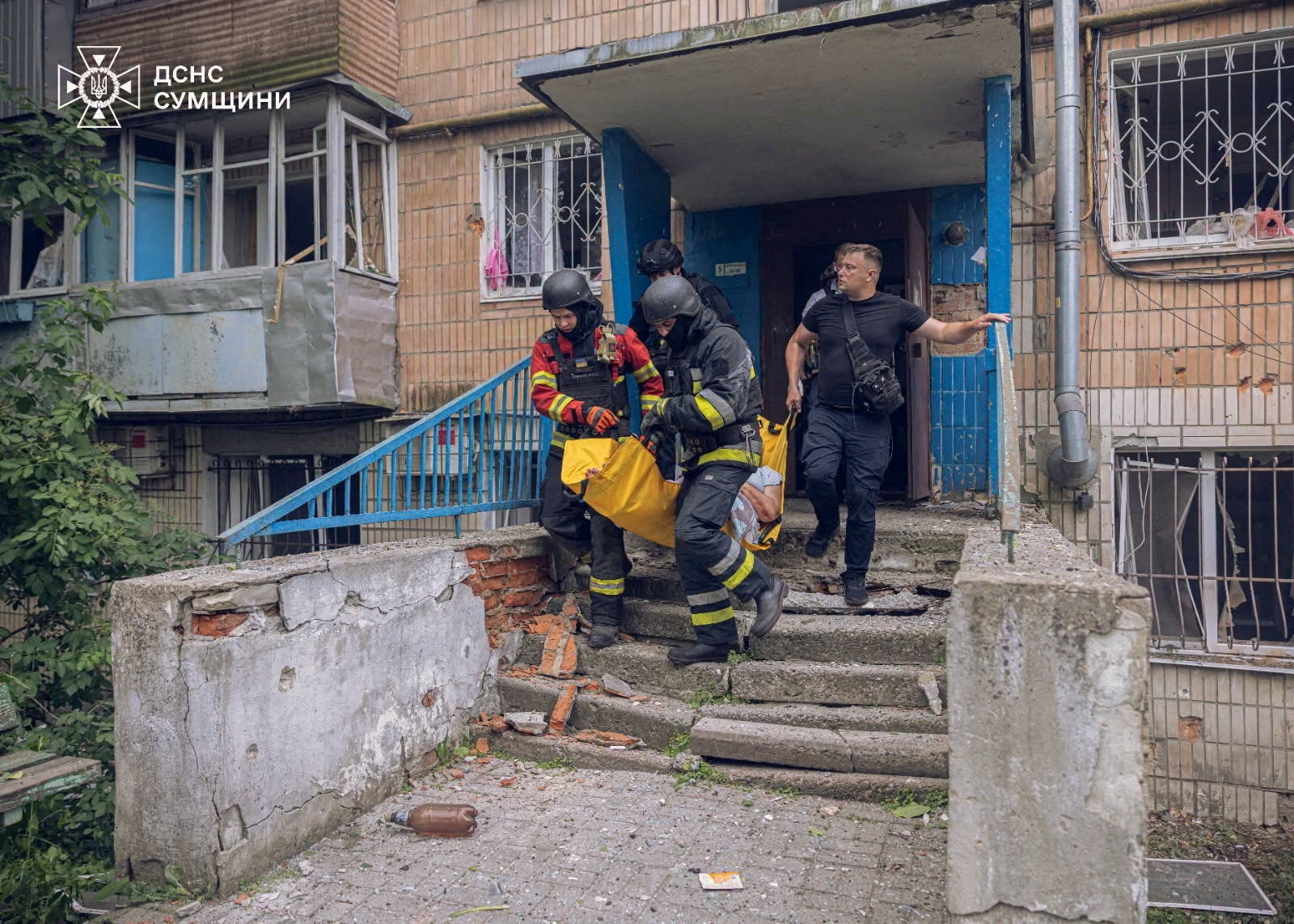 Rescuers respond to a Russian drone attack which struck an apartment building in Sumy, Ukraine, on Saturday