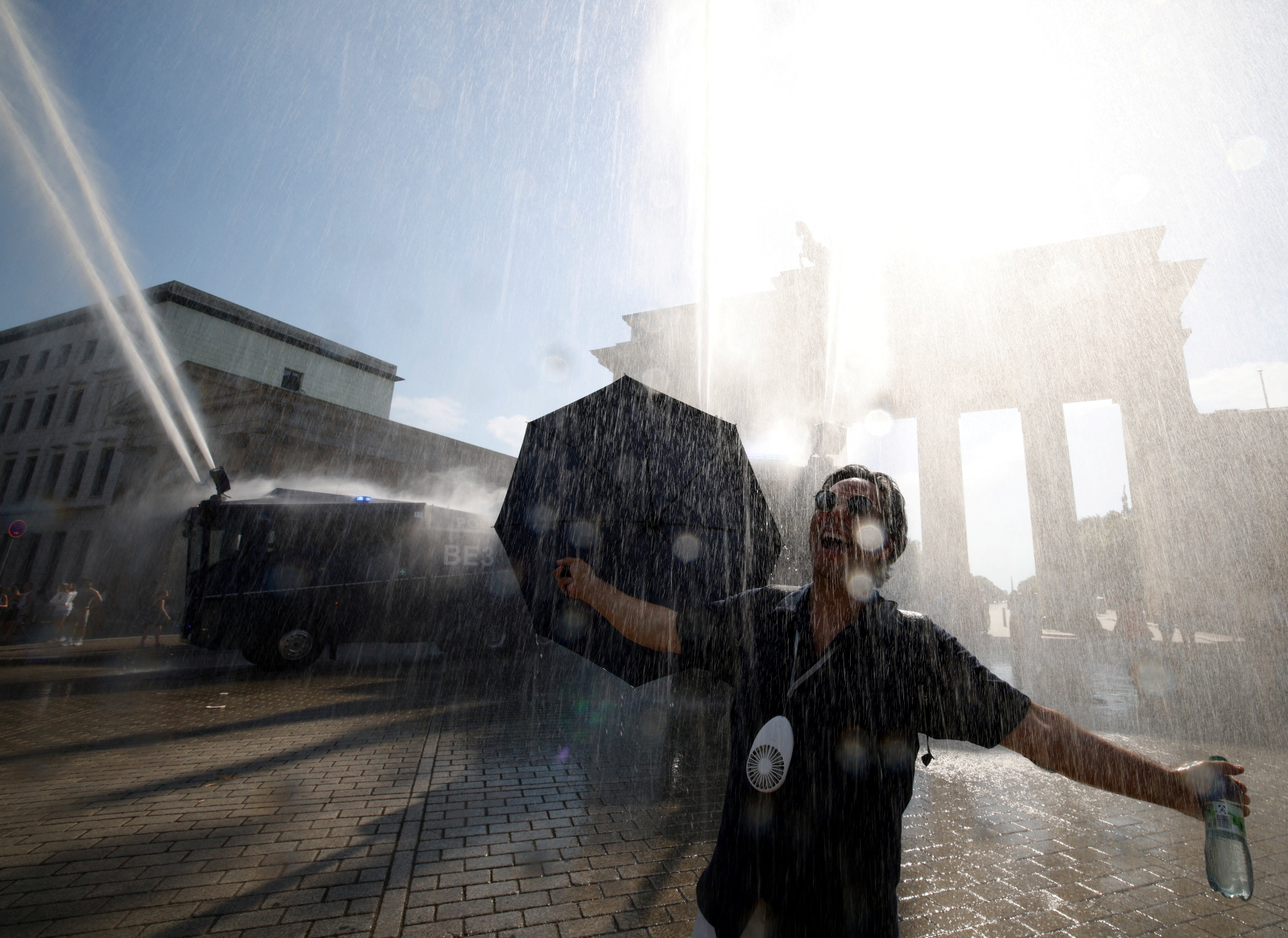 A man in Berlin as the deadly heatwave moves east to mainland Europe