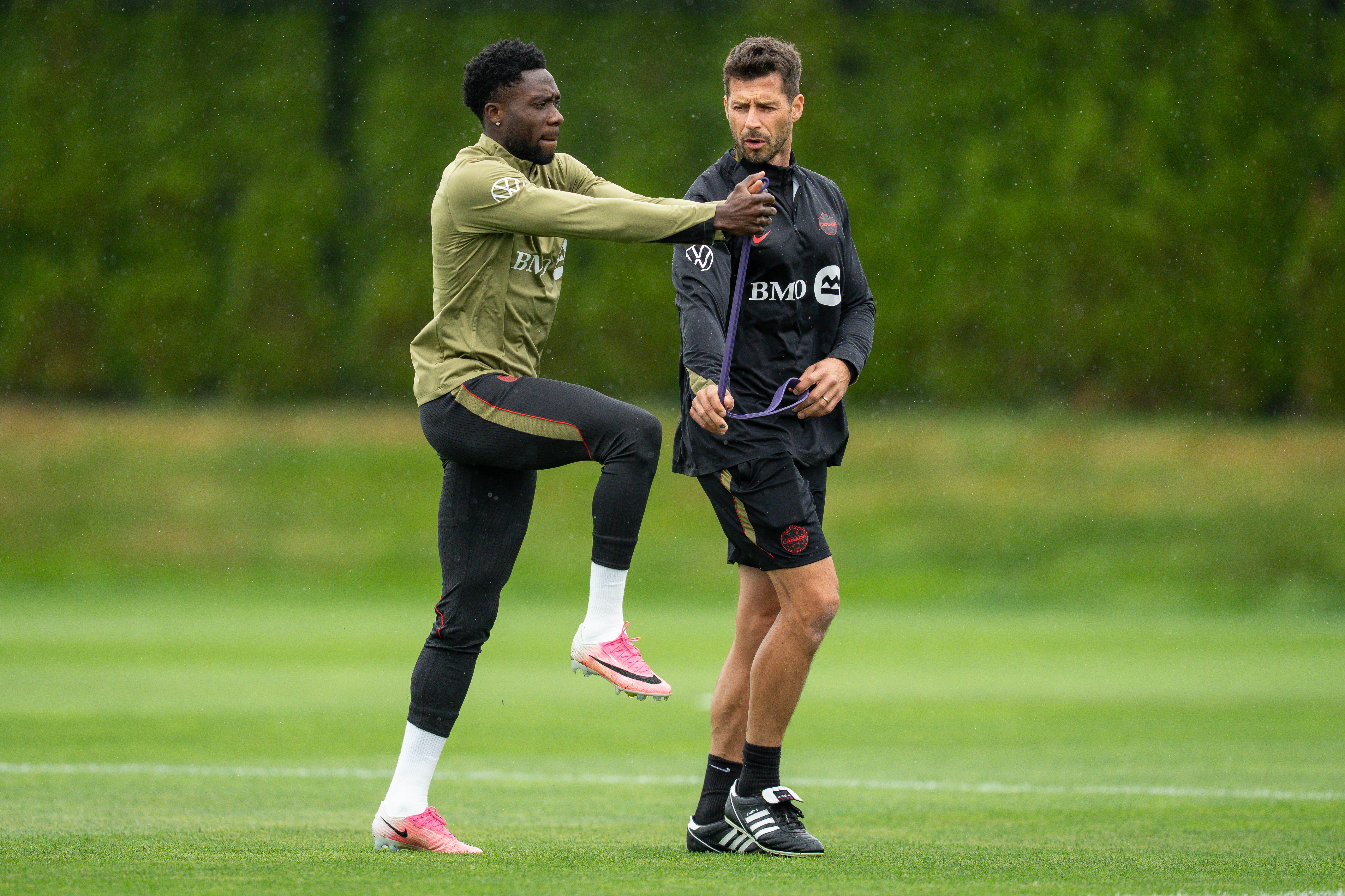 Alphonso Davies (left) is nearing a return for Canada (AP)