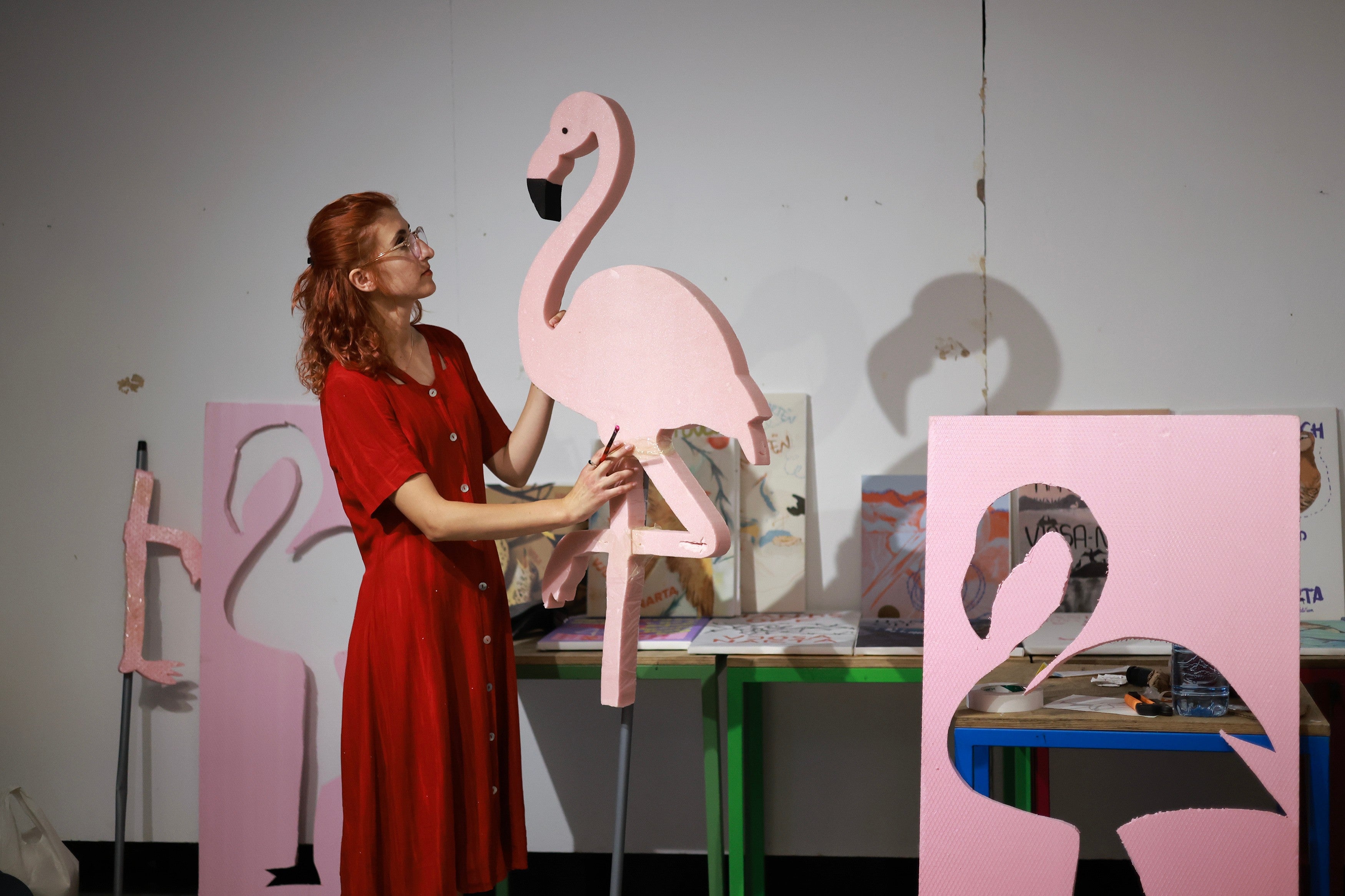 Fatma Paja handcrafts foam flamingos in order to be used at protests against a coastal development project in western Albania linked to Jared Kushner, son-in-law of President Donald Trump, in Tirana, Albania, Friday, June 26, 2026. (AP Photo/Hameraldi Agolli) (AP)