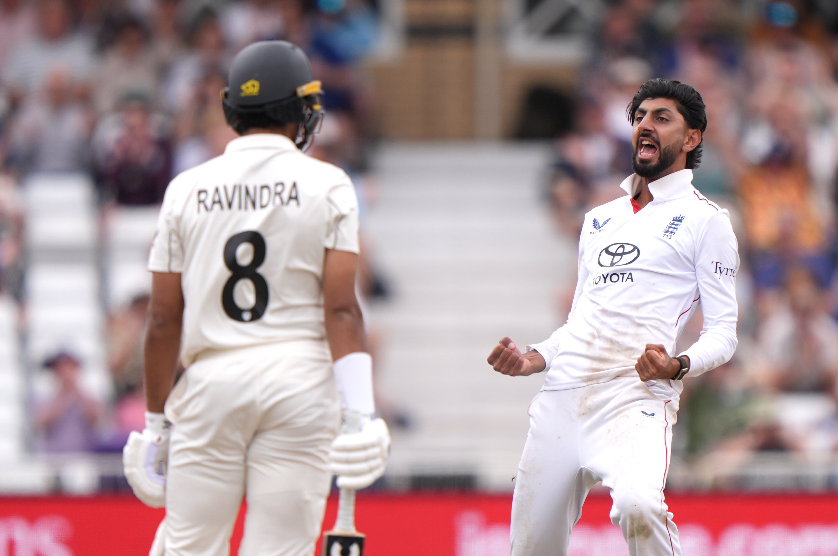 Shoaib Bashir celebrates taking the dismissal of Rachin Ravindra (Joe Giddens/PA)