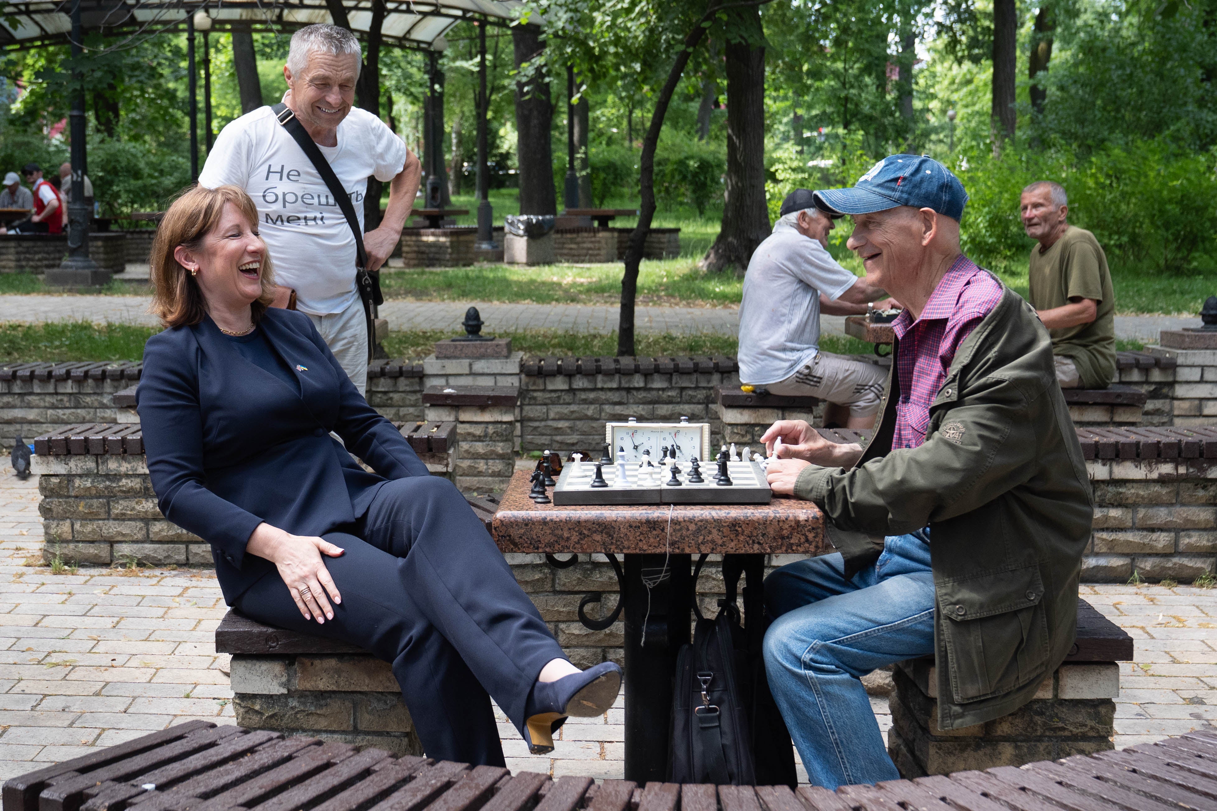 Chancellor of the Exchequer Rachel Reeves plays chess with members of the public in Taras Shevchenko Park (PA)