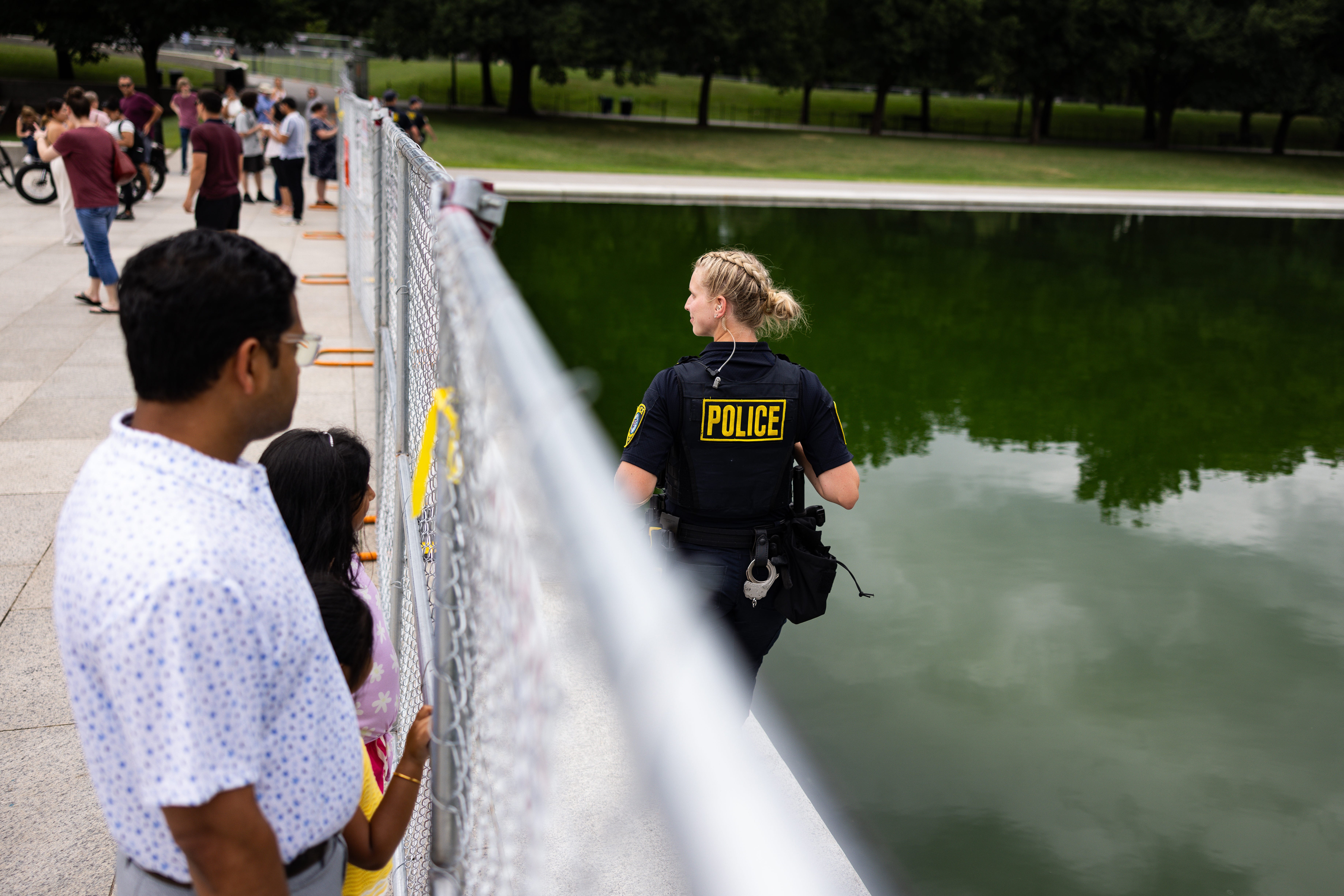 The site of the Lincoln Memorial Reflecting Pool in Washington D.C. has become a secure scene as passerby have been blocked from touching the pool's waters or getting close
