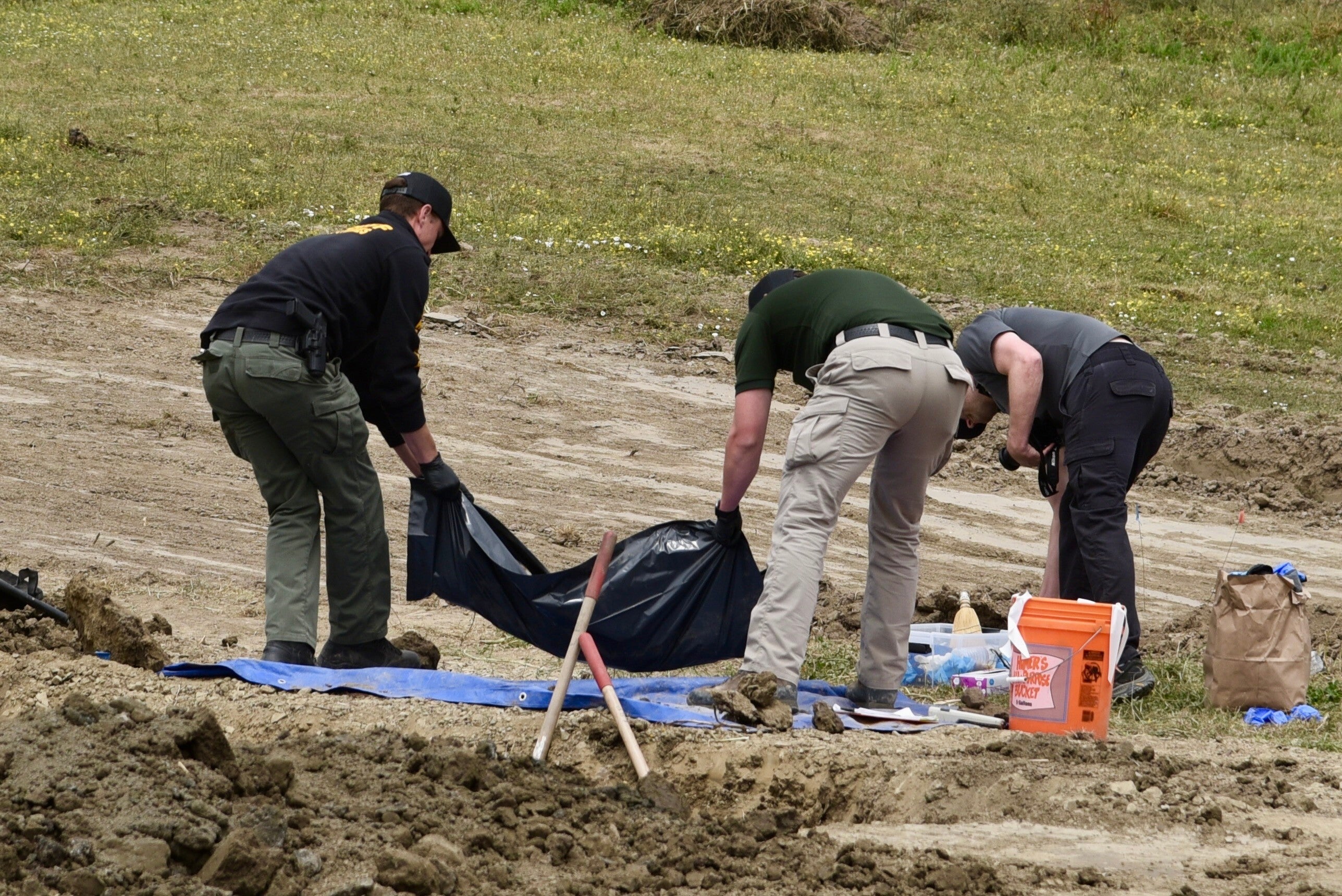 More than 600 dog collars were found in a nearby barn, where investigators believed the animals were killed (AP)