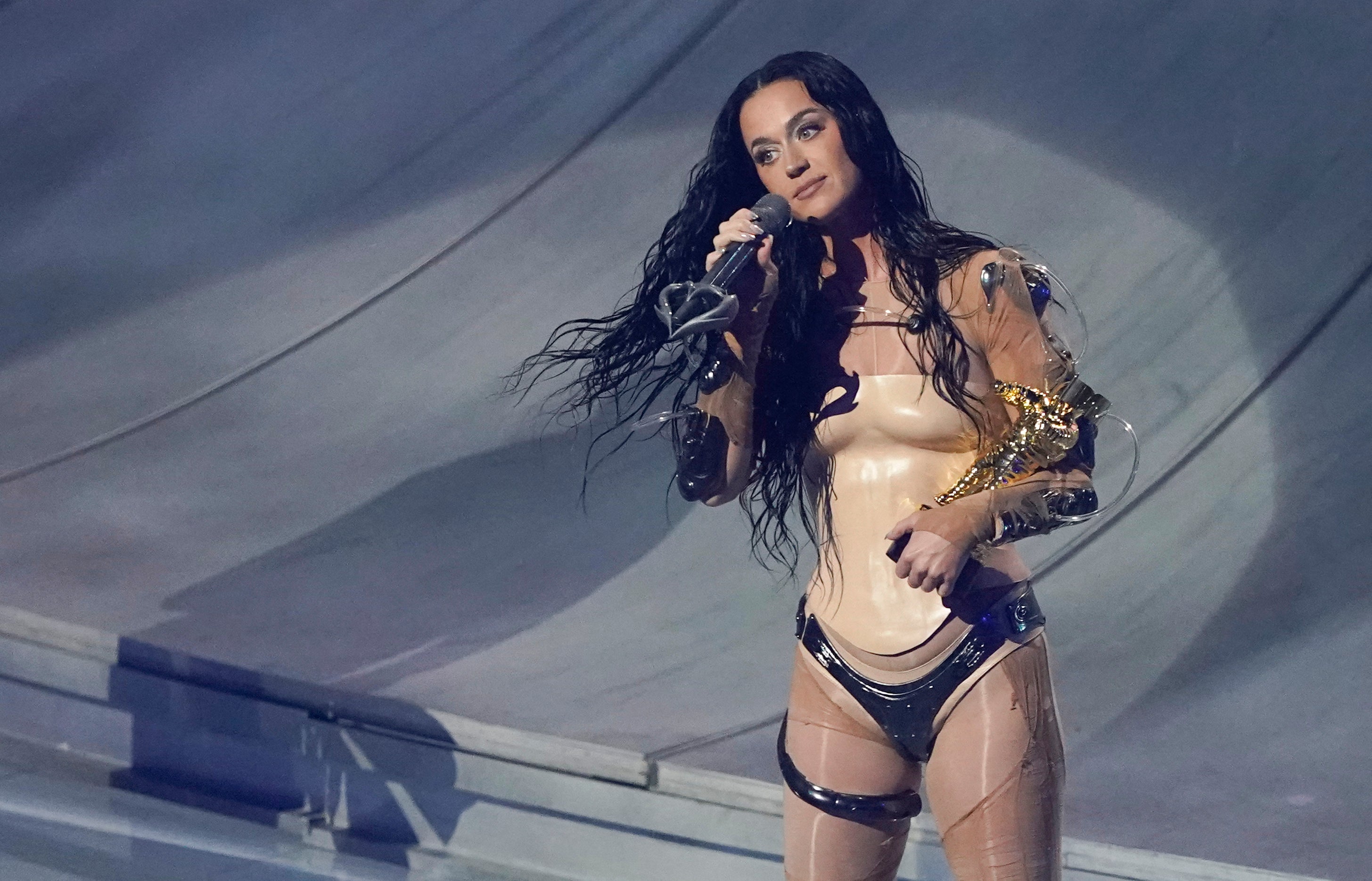 US singer Katy Perry holds the MTV Video Vanguard award after performing on stage