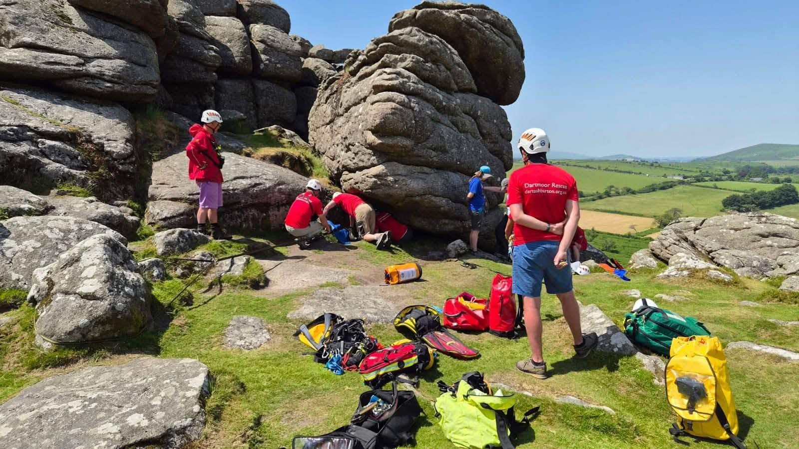 Rescuers working to free a schoolgirl trapped on Hound Tor, Dartmoor, Devon