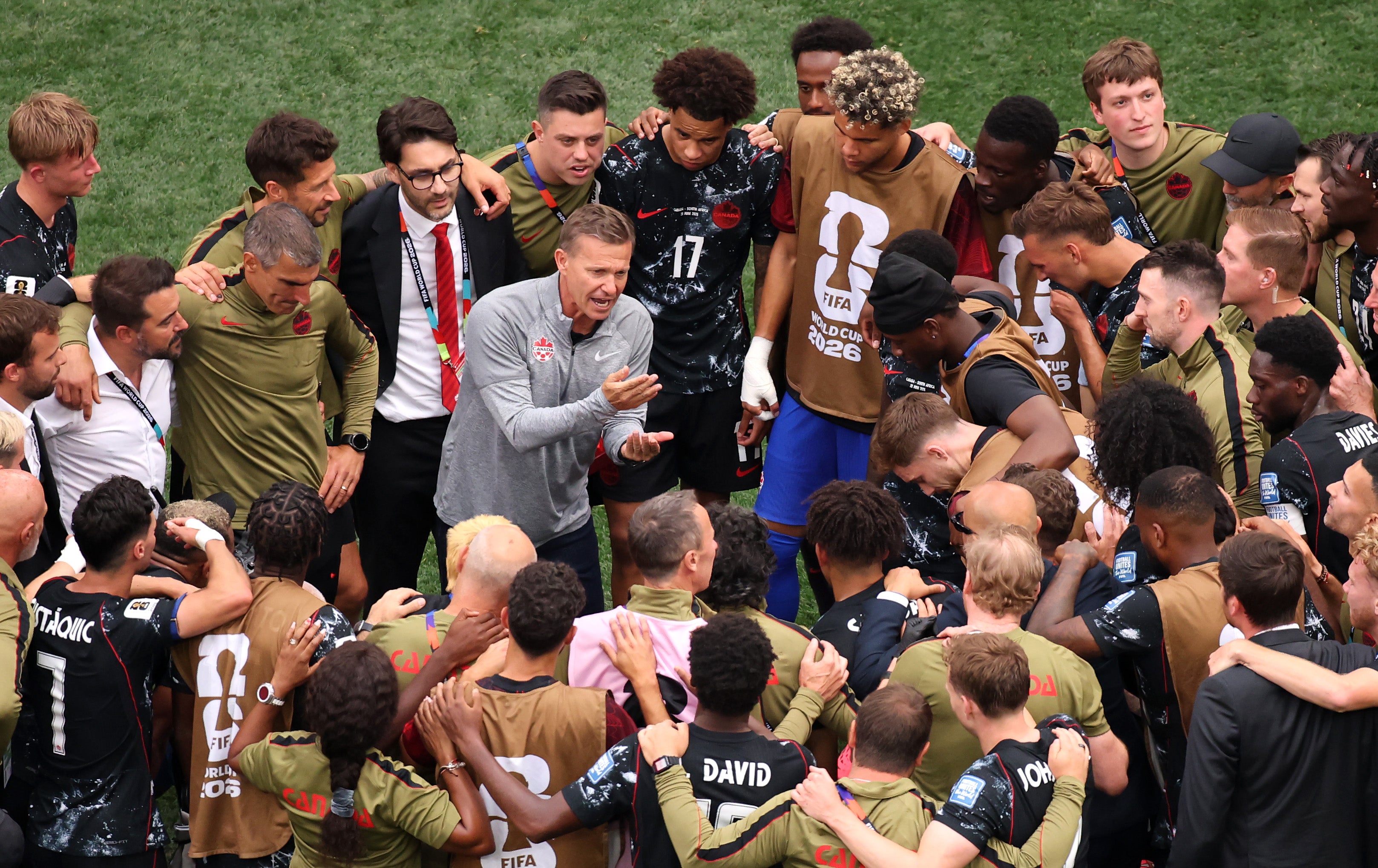 Jesse Marsch spoke to his players on the pitch after Canada's win over South Africa