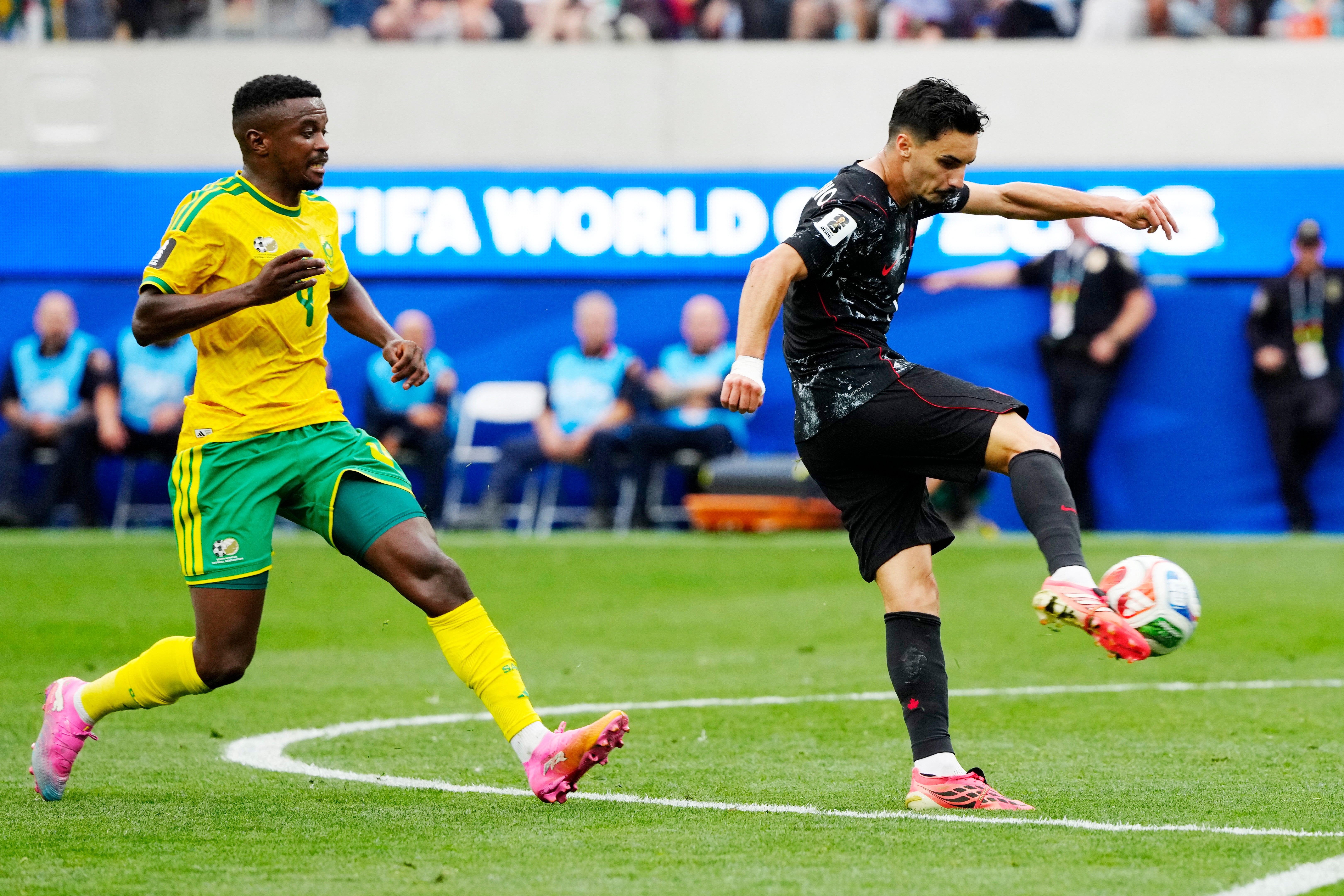 Canada's Stephen Eustáquio (7) scores a goal against South Africa as Teboho Mokoena (4) chases during the World Cup round of 32 soccer match, in Los Angeles, on Sunday, June 28, 2026. (Frank Gunn/The Canadian Press via AP)