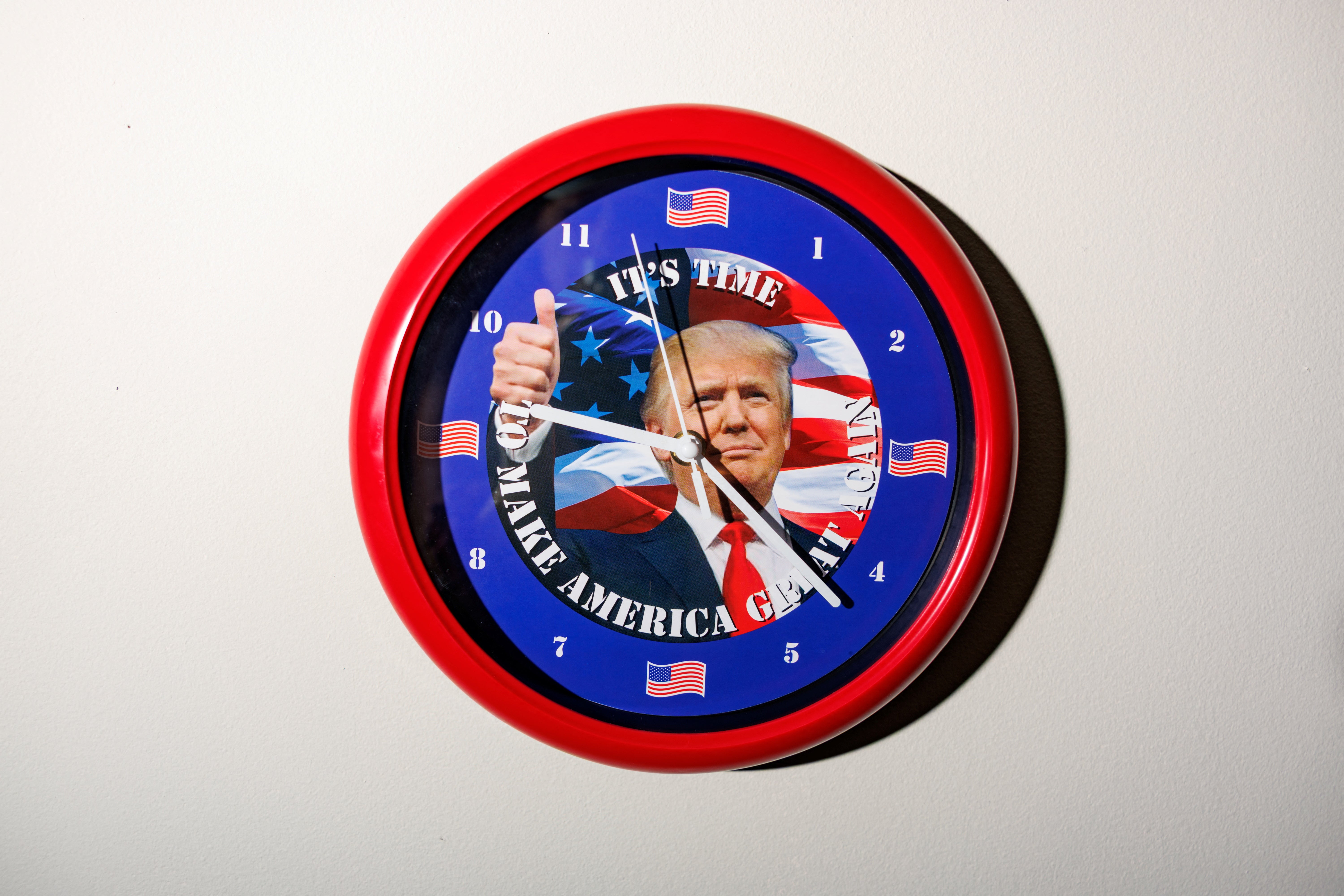 A clock featuring U.S. President Donald Trump hangs on the wall in the office of Dan Marrazzo, owner of Laundry Depot Laundromats and President Trump's supporter